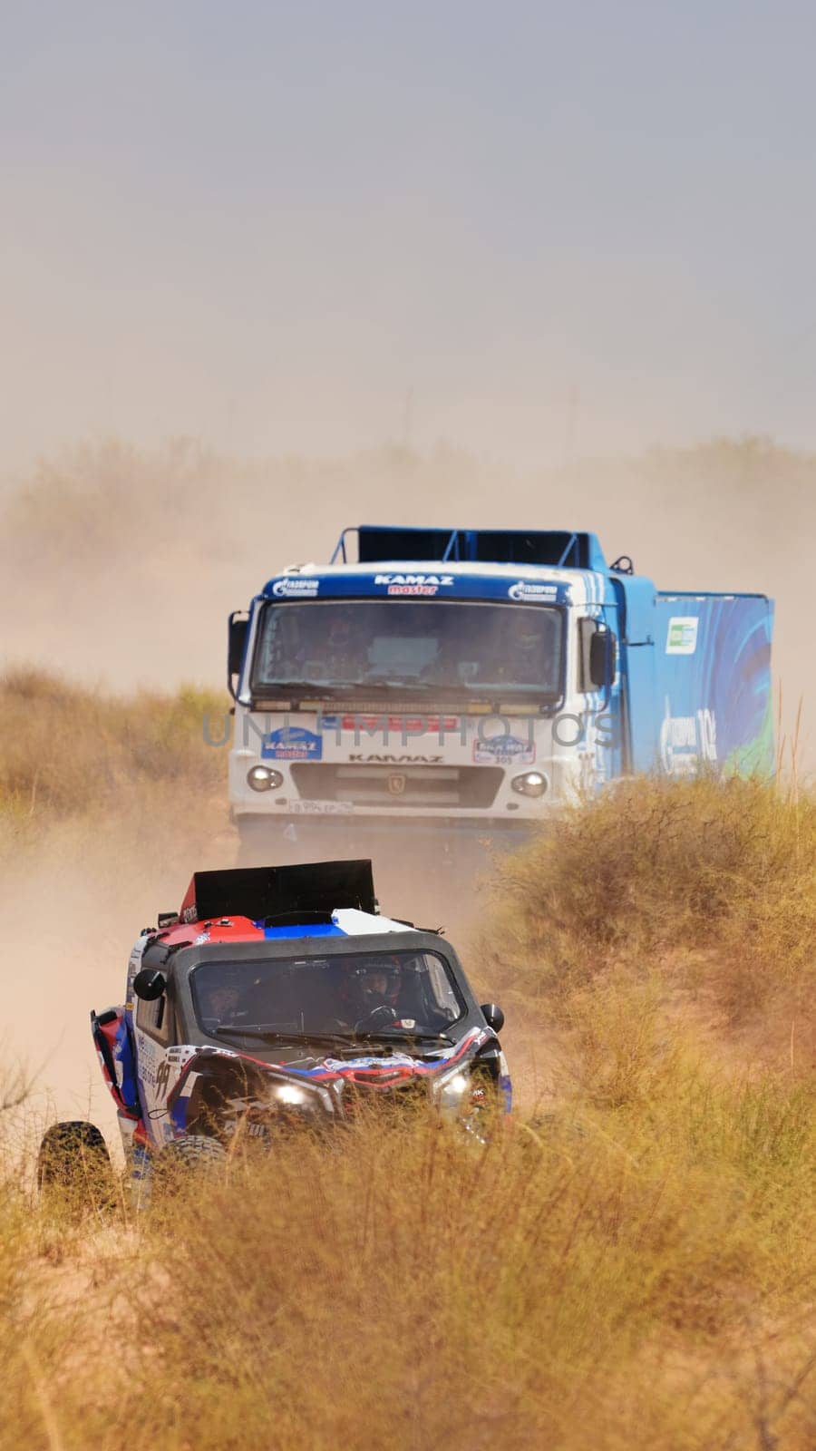 Extreme off-road racing. Sports car gets over the difficult part of the route during the Rally raid in sand. 14.07.2022 Kalmykia, Russia.