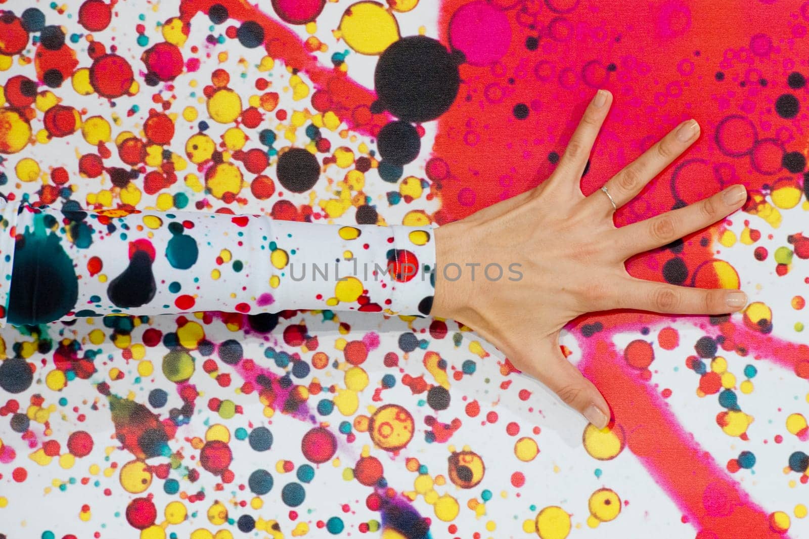 female hand detail on multi colour bubble wall