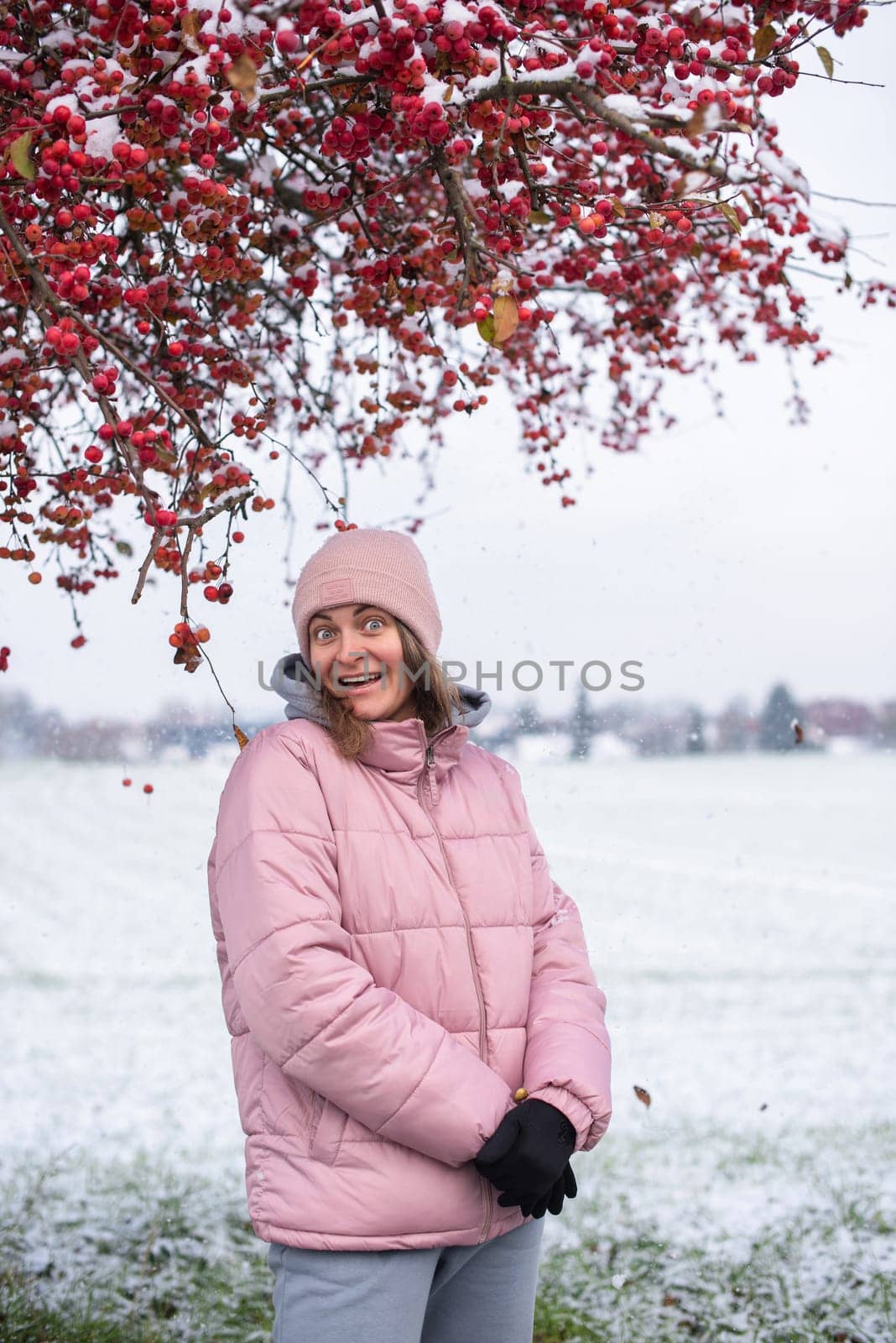 Winter Elegance: Portrait of a Beautiful Girl in a Snowy European Village