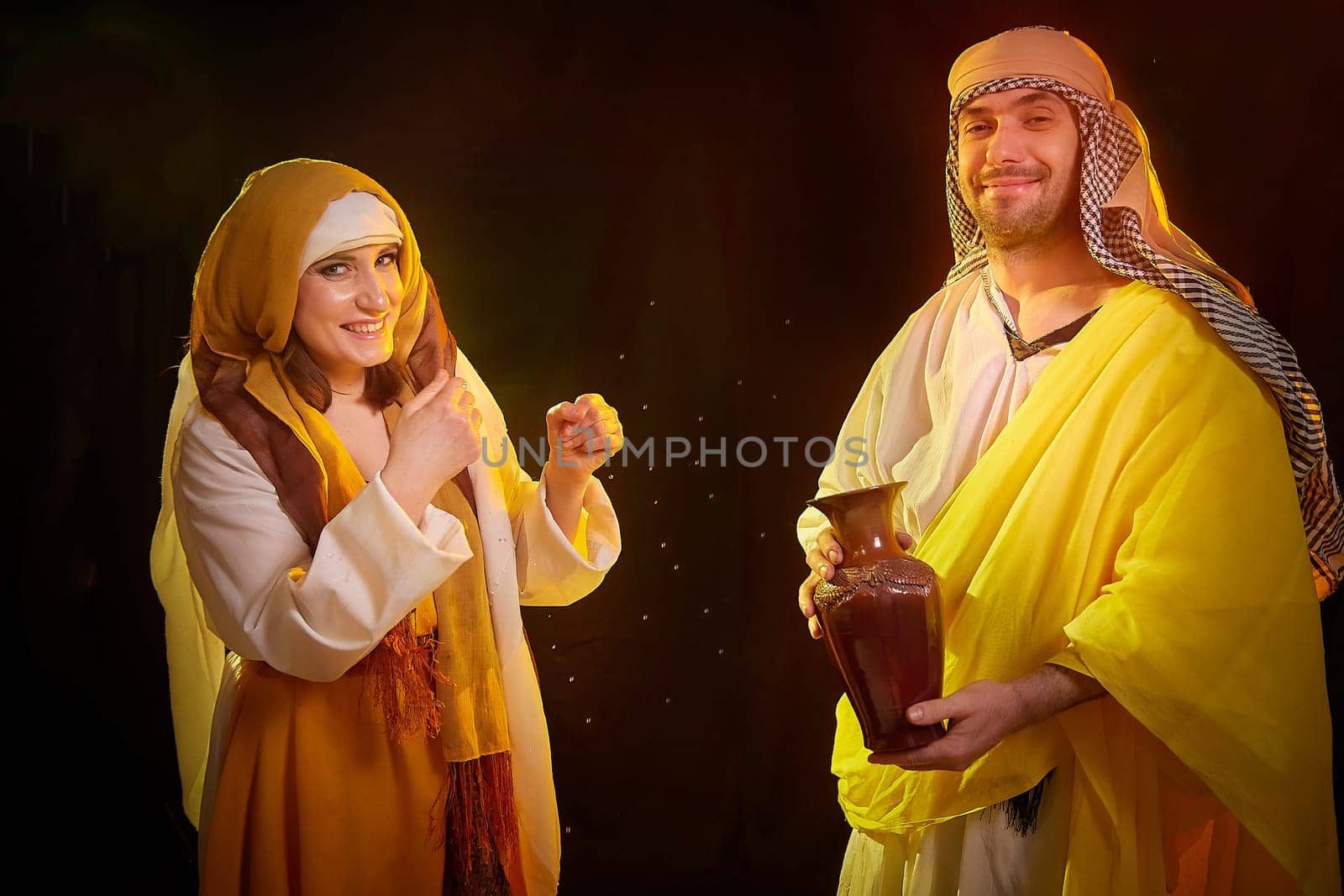 A couple in love or a married couple in stylized Eastern clothing from Israel, Palestine, Iran, Pakistan together. Tender photo session in the style of the Middle East and the Bible