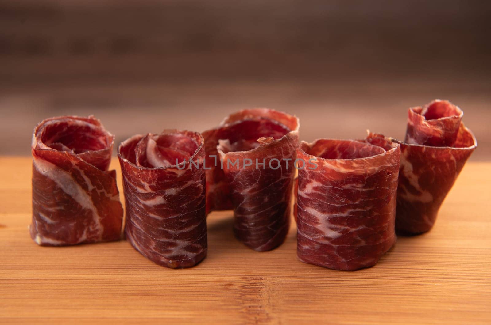 Dry-cured Spanish ham, Serrano ham, Bellota ham, Italian prosciutto crudo or Parma ham, wagyu slice. High quality photo