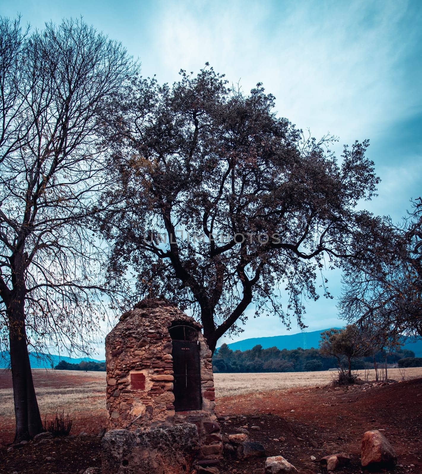 View of stone barn and in open field on morning. Farming house in the countryside of a small village in Catalonia. by _Nataly_Nati_