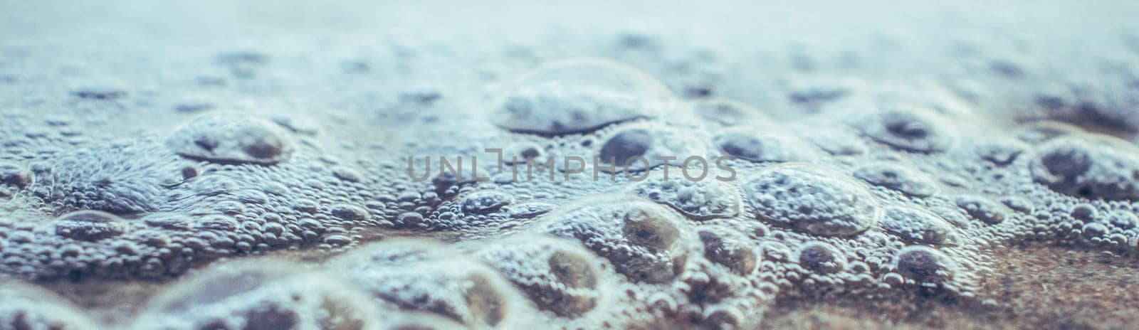 Close up sea water with little bubbles photo. Surface with selective focus by _Nataly_Nati_