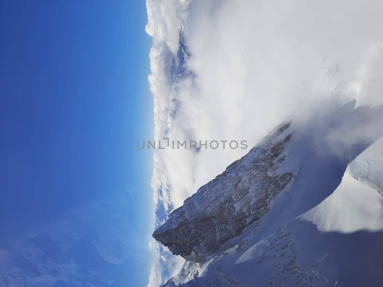 Snow covered mountain top in Austria. View of the Alps from the Zugspitze, the highest mountain in Germany by Costin