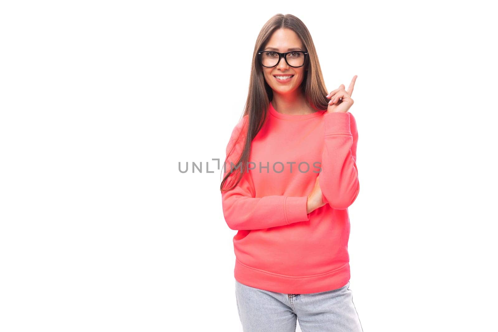 young caucasian model woman with light make-up and dark straight hair dressed in a pink sweater wears eyeglasses by TRMK