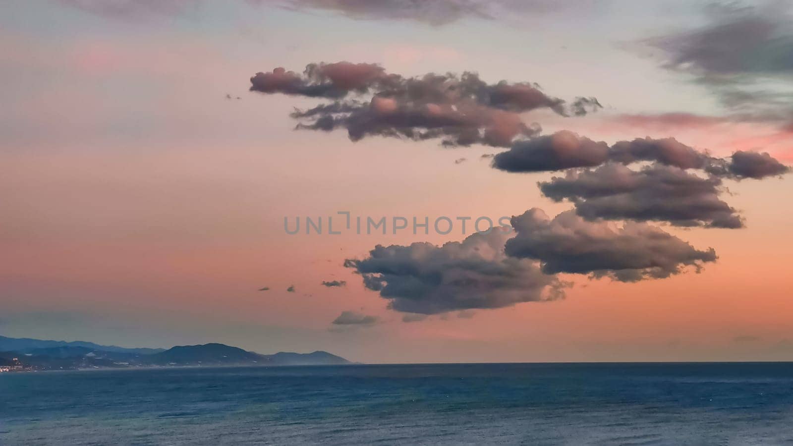 Pink and blue clouds in evening pink sky over sea, twilight fairy sunset, copy space by Laguna781