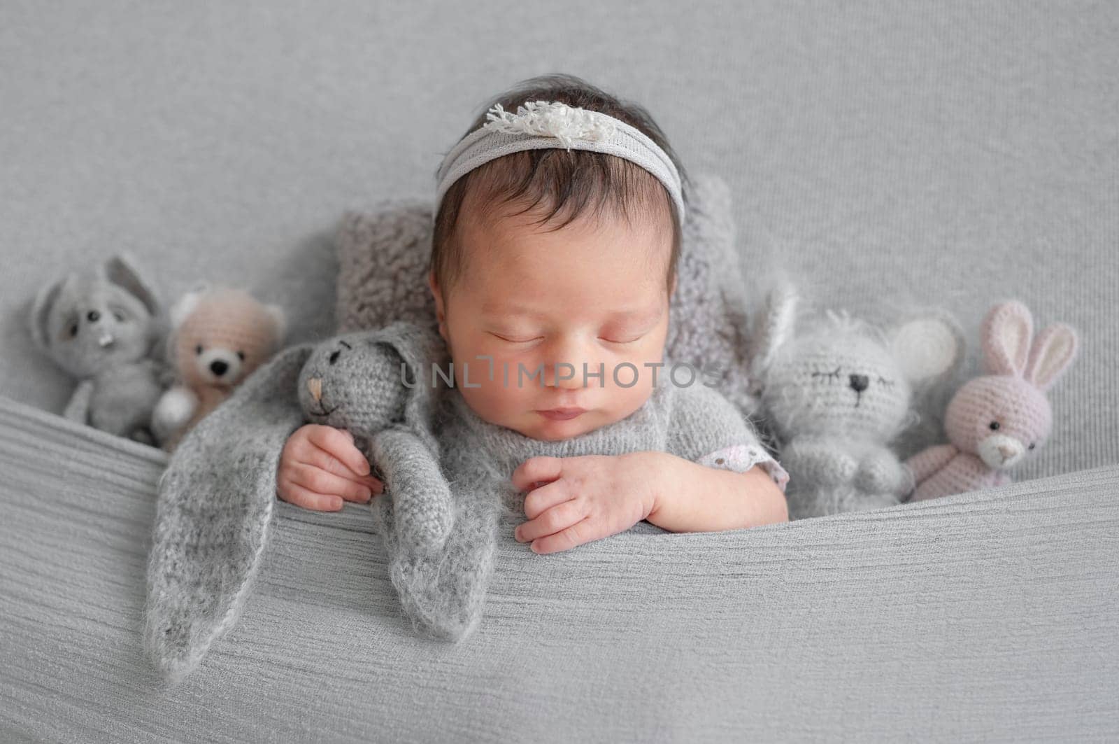 Newborn Girl Sleeping Under Blanket With Toys by tan4ikk1