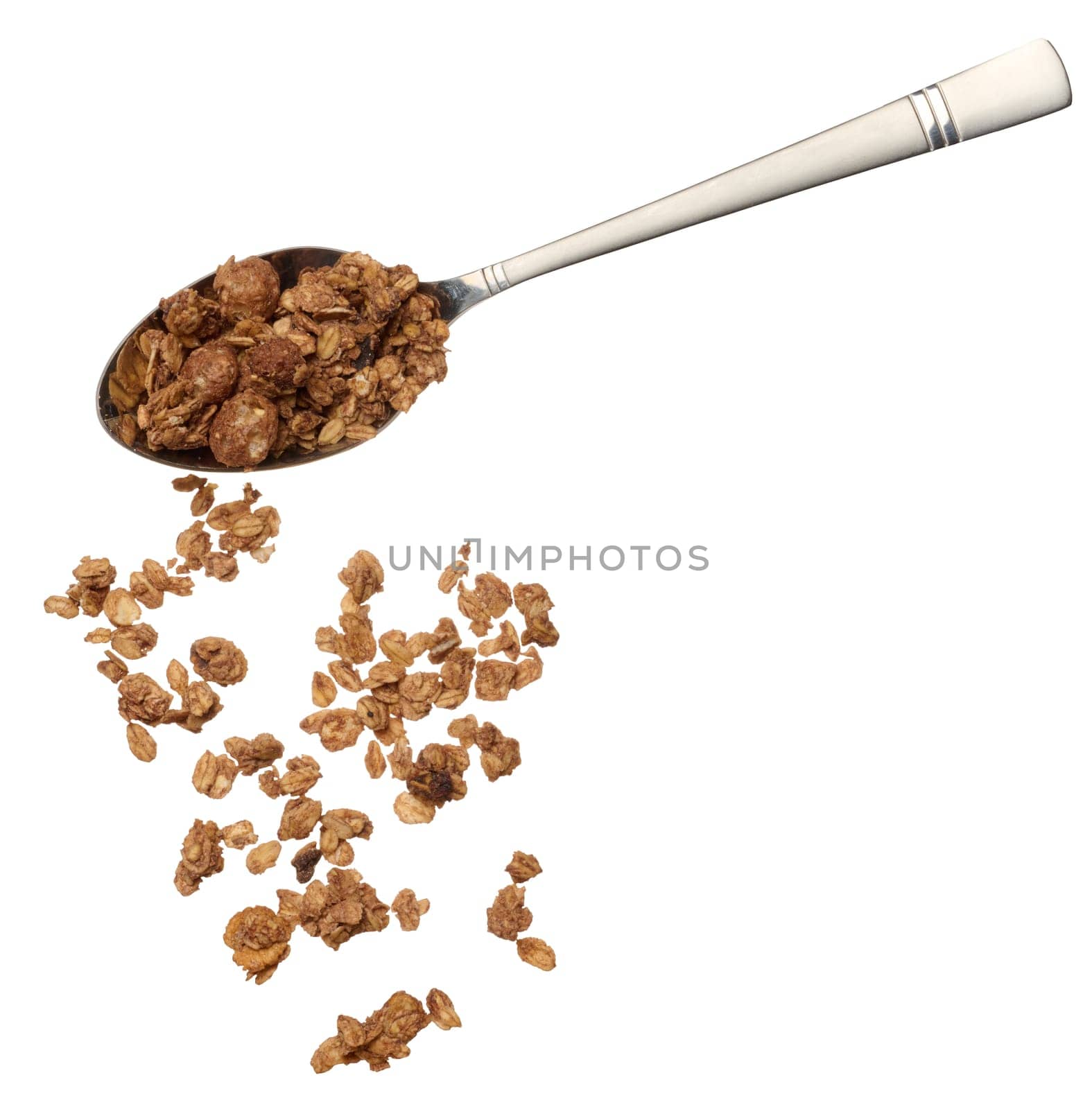 Scattered chocolate crunches from a metal spoon on an isolated background by ndanko