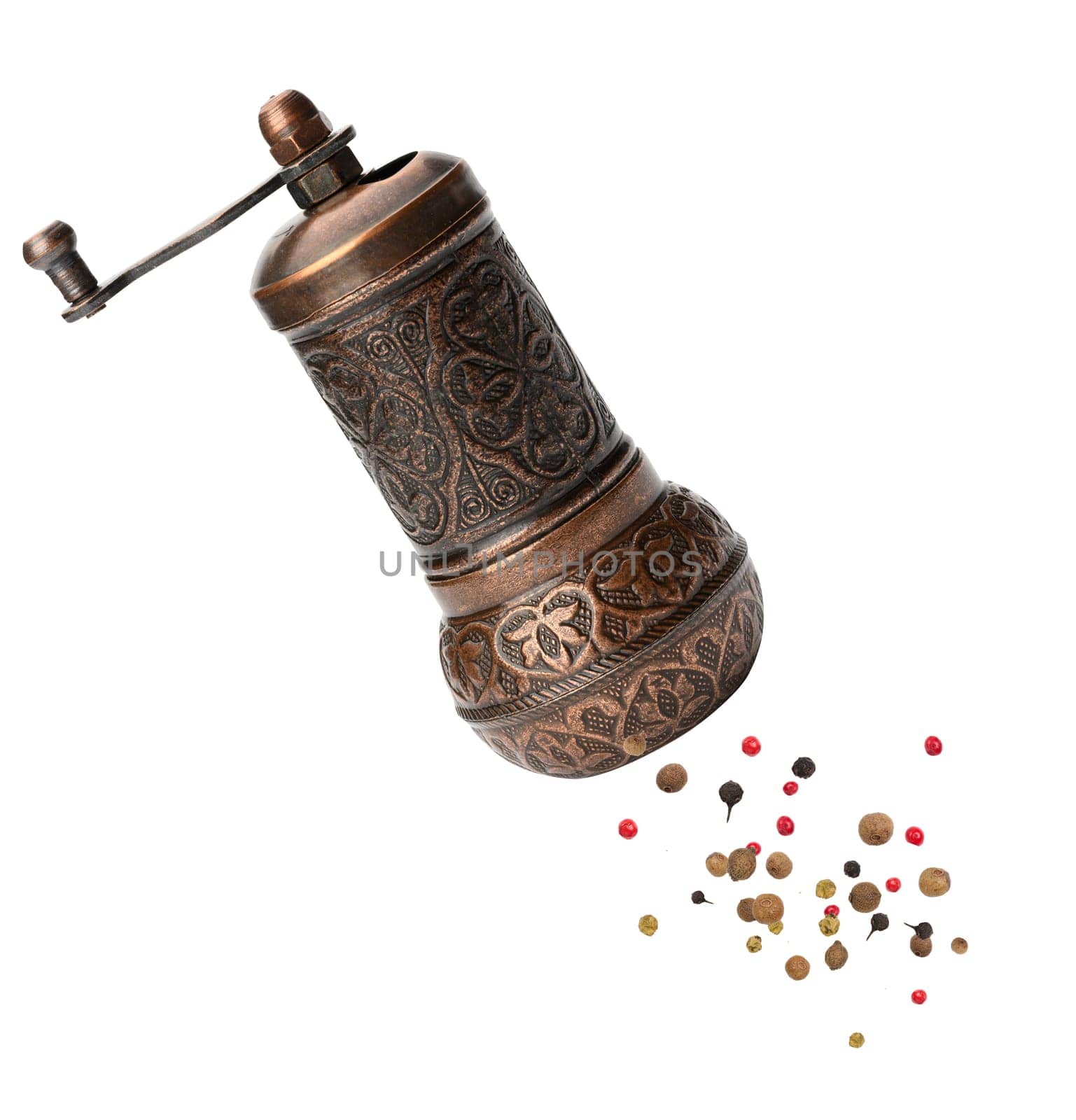 Copper hand mill for pepper and salt isolated on white background by ndanko