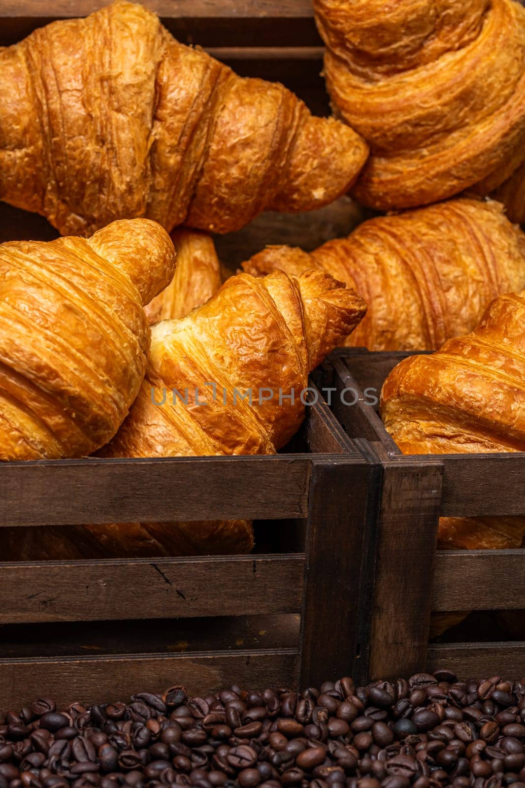 Freshly baked golden brown French croissants. Tasty baked croissants, warm buttery croissants with coffee, breakfast concept by vladispas
