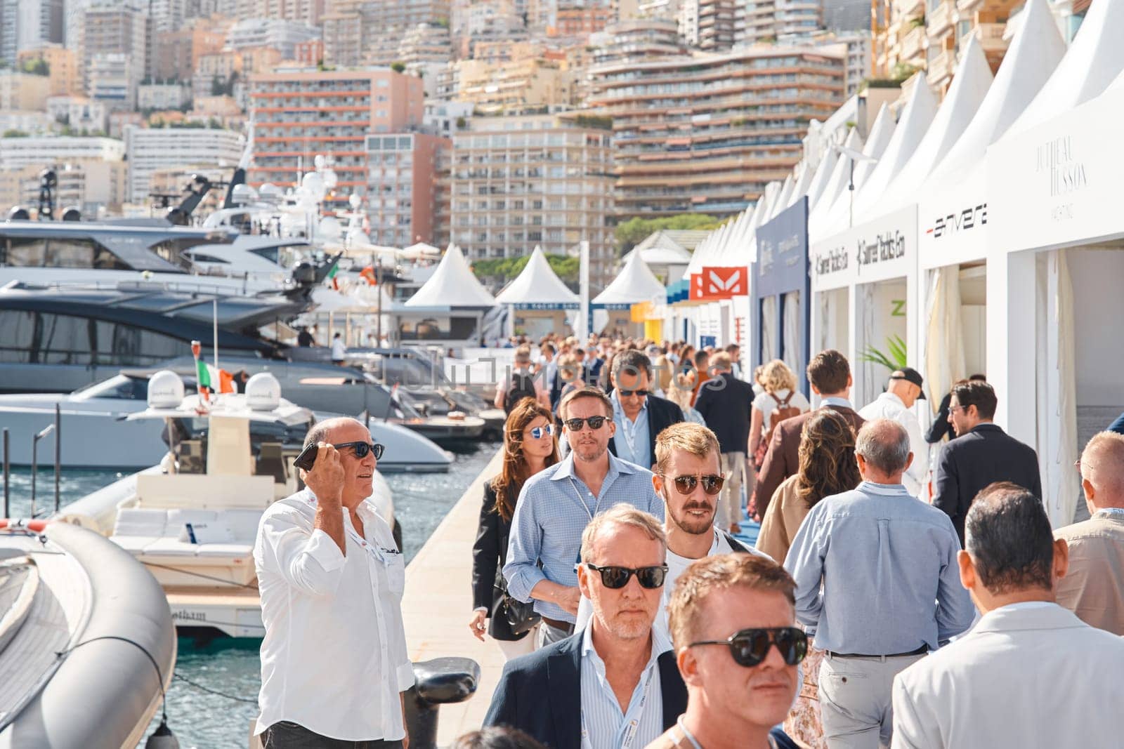 Monaco, Monte Carlo, 29 September 2022 - a lot of people, clients and yacht brokers look at the mega yachts presented, discuss the novelties of the boating industry at the famous motorboat exhibition by vladimirdrozdin