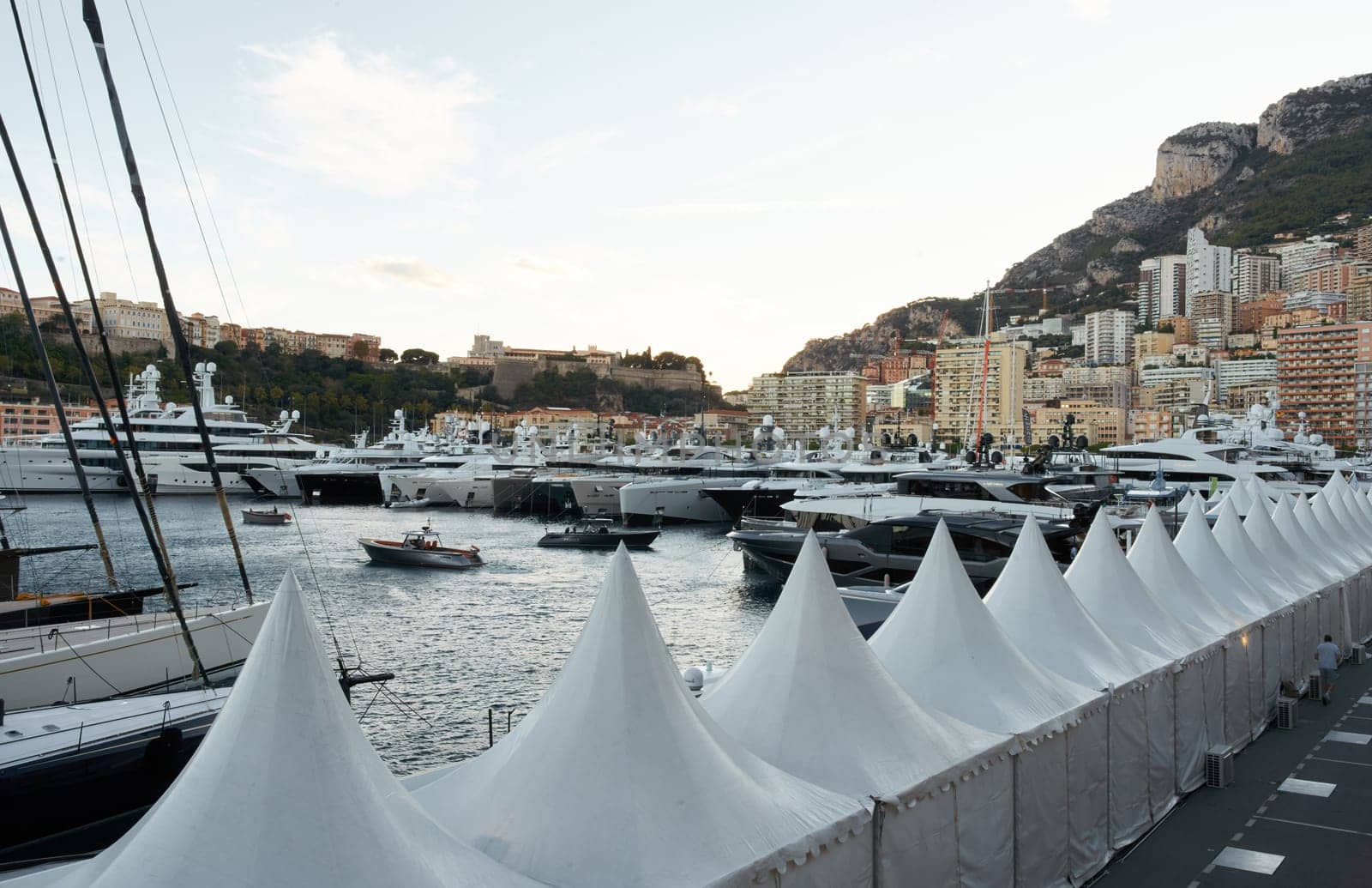 Monaco, Monte Carlo, 29 September 2022 - a lot of luxury yachts at the famous motorboat exhibition at sunset, the most expensive boats for the richest people, yacht brokers, boat traffic. High quality photo