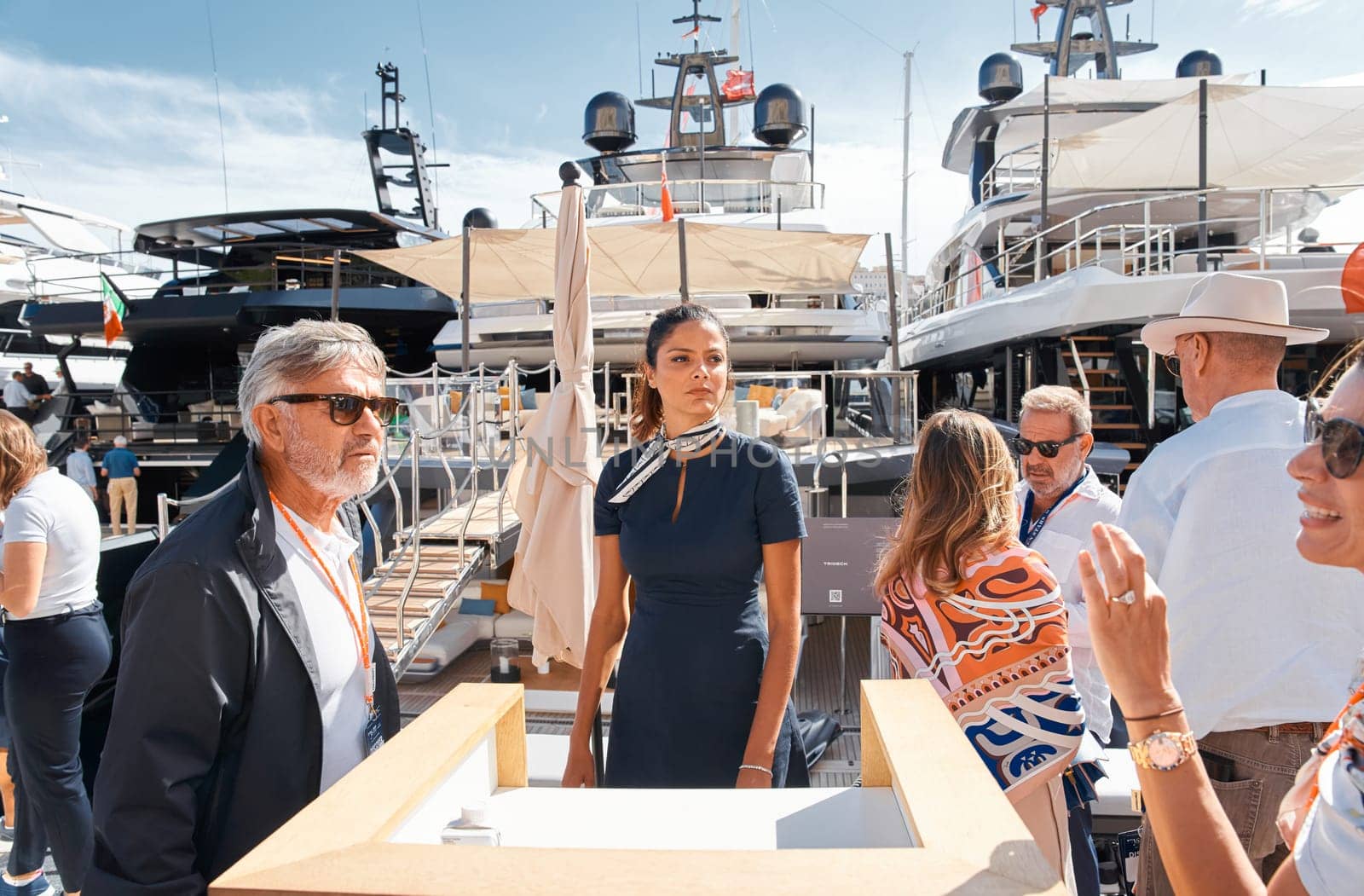 Monaco, Monte Carlo, 29 September 2022 - clients and yacht brokers look at the mega yachts presented, discuss the novelties of the boating industry at the famous motorboat exhibition. High quality photo