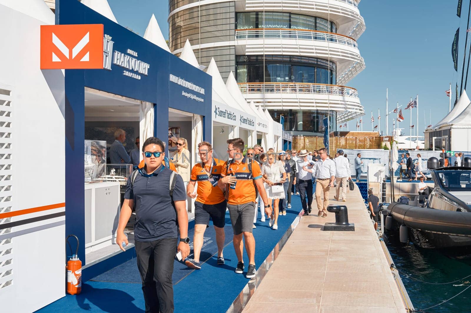 Monaco, Monte Carlo, 28 September 2022 - a lot of people, clients and yacht brokers look at the mega yachts presented, discuss the novelties of the boating industry at the famous motorboat exhibition. High quality photo