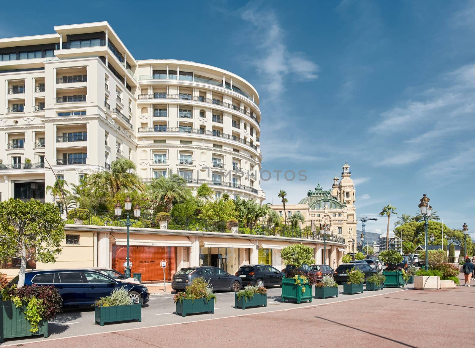 Monaco, Monte-Carlo, 29 September 2022 - Famous landmark Casino Monte-Carlo and hotel de Paris at sunny day, lifestyle of principality, wealth life, expensive luxury cars, sightseeing. High quality photo