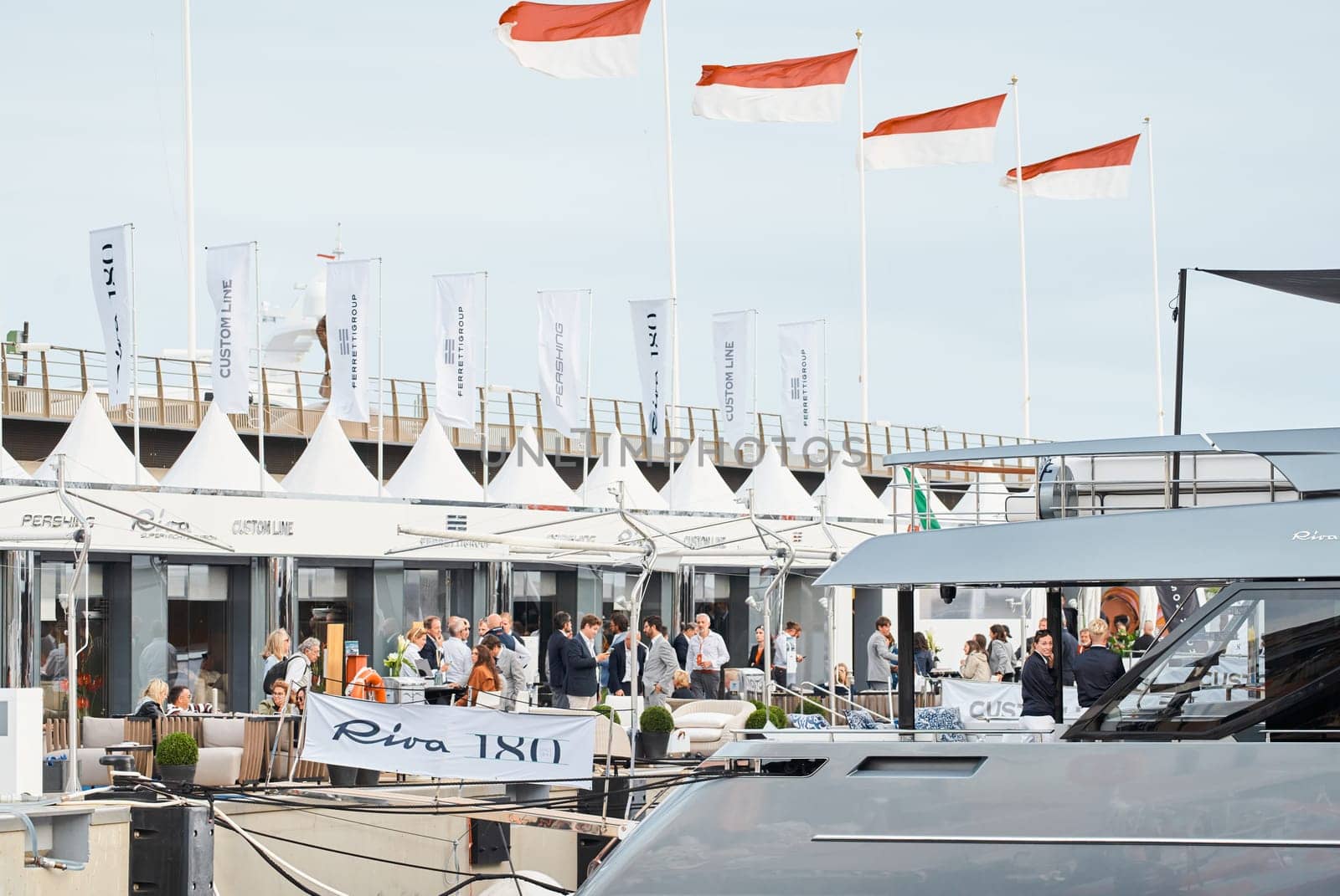 Monaco, Monte Carlo, 29 September 2022 - The famous motorboat exhibition, mega yacht show, clients and yacht brokers discuss the novelties of the boating industry, look at the mega yachts presented. High quality photo