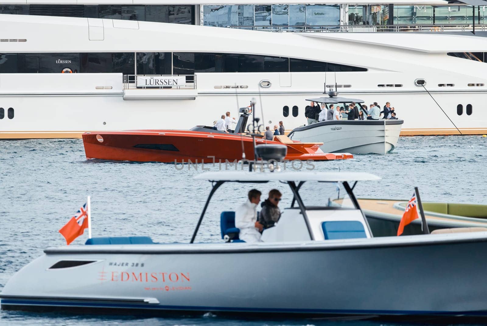 Monaco, Monte Carlo, 29 September 2022 - Water taxi by luxury motorboat on the famous yacht exhibition, a lot of most expensive luxury yachts, richest people, yacht brokers, boat traffic by vladimirdrozdin