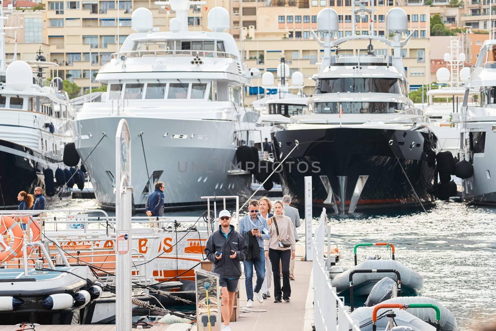 Monaco, Monte Carlo, 29 September 2022 - The famous motorboat exhibition, mega yacht show, clients and yacht brokers discuss the novelties of the boating industry, look at the mega yachts presented. High quality photo