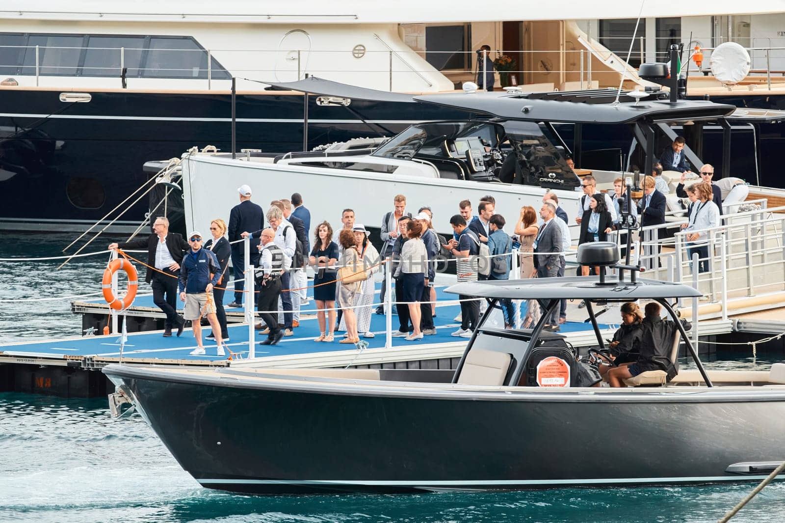 Monaco, Monte Carlo, 29 September 2022 - Water taxi by luxury motorboat on the famous yacht exhibition, a lot of most expensive luxury yachts, richest people, yacht brokers, boat traffic by vladimirdrozdin