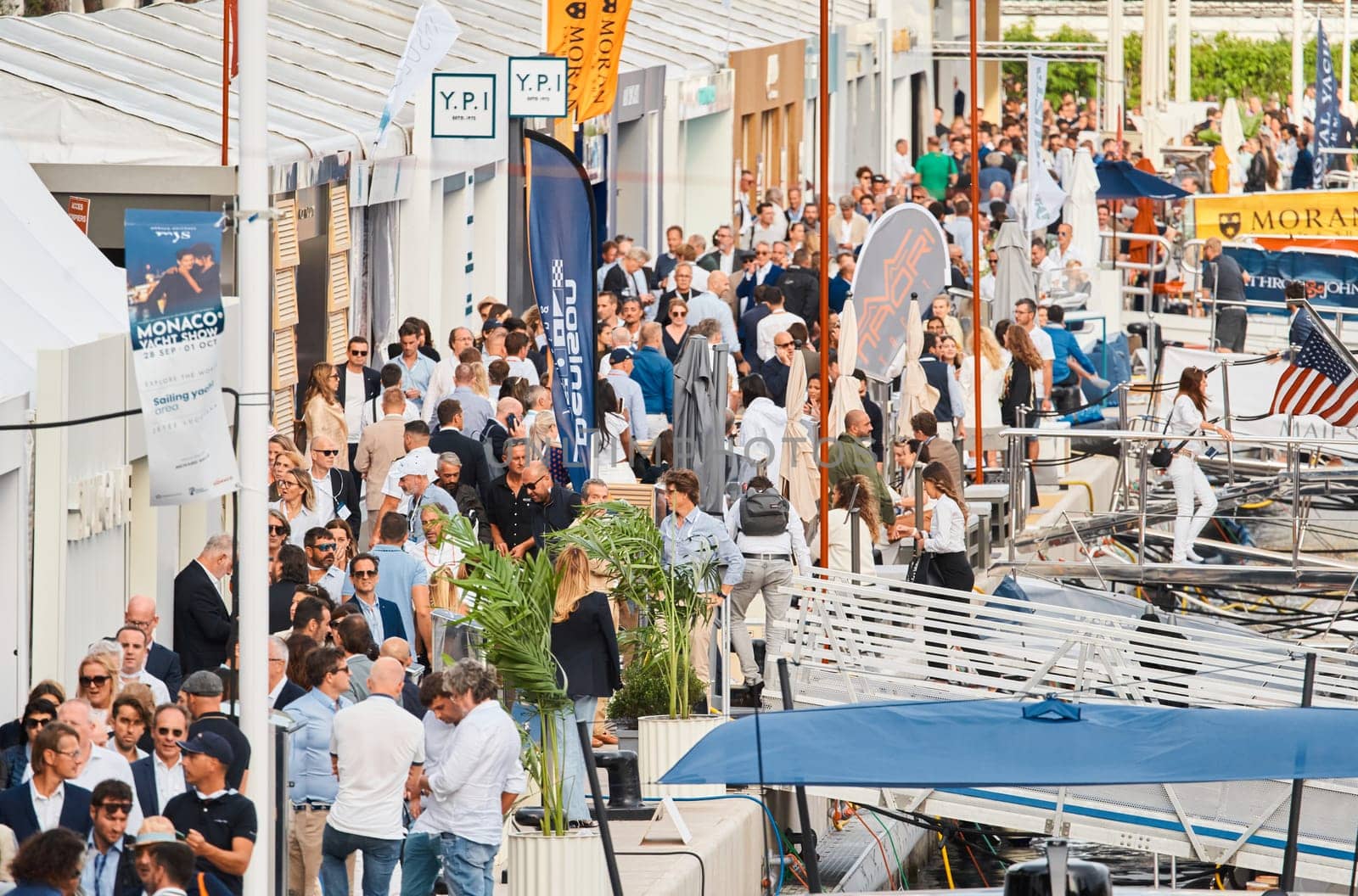 Monaco, Monte Carlo, 29 September 2022 - The famous motorboat exhibition, mega yacht show, clients and yacht brokers discuss the novelties of the boating industry, look at the mega yachts presented. High quality photo