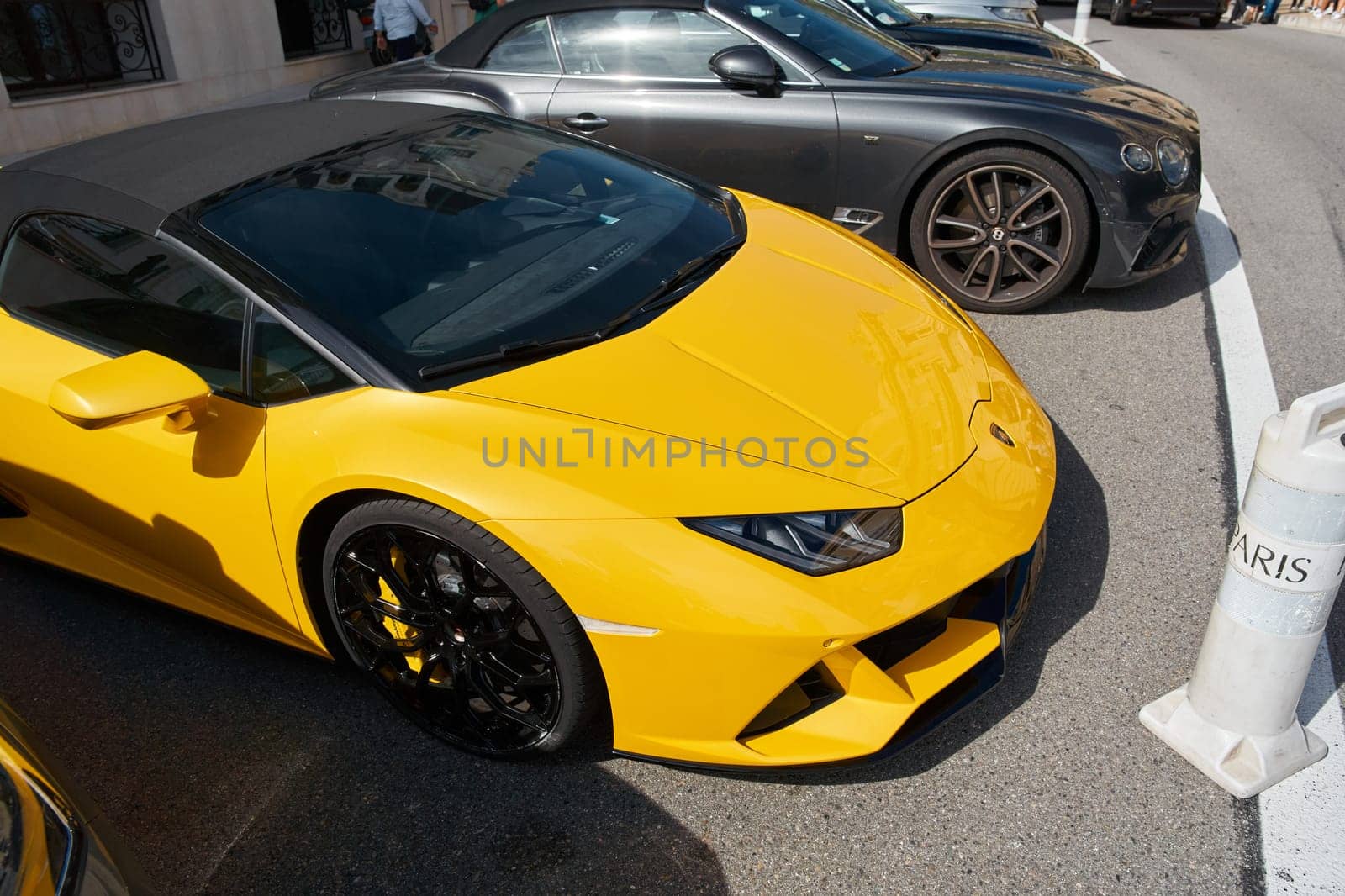 Monaco, Monte Carlo, 29 September 2022 - Close-up view of yellow sports car Lamborghini on street. High quality photo