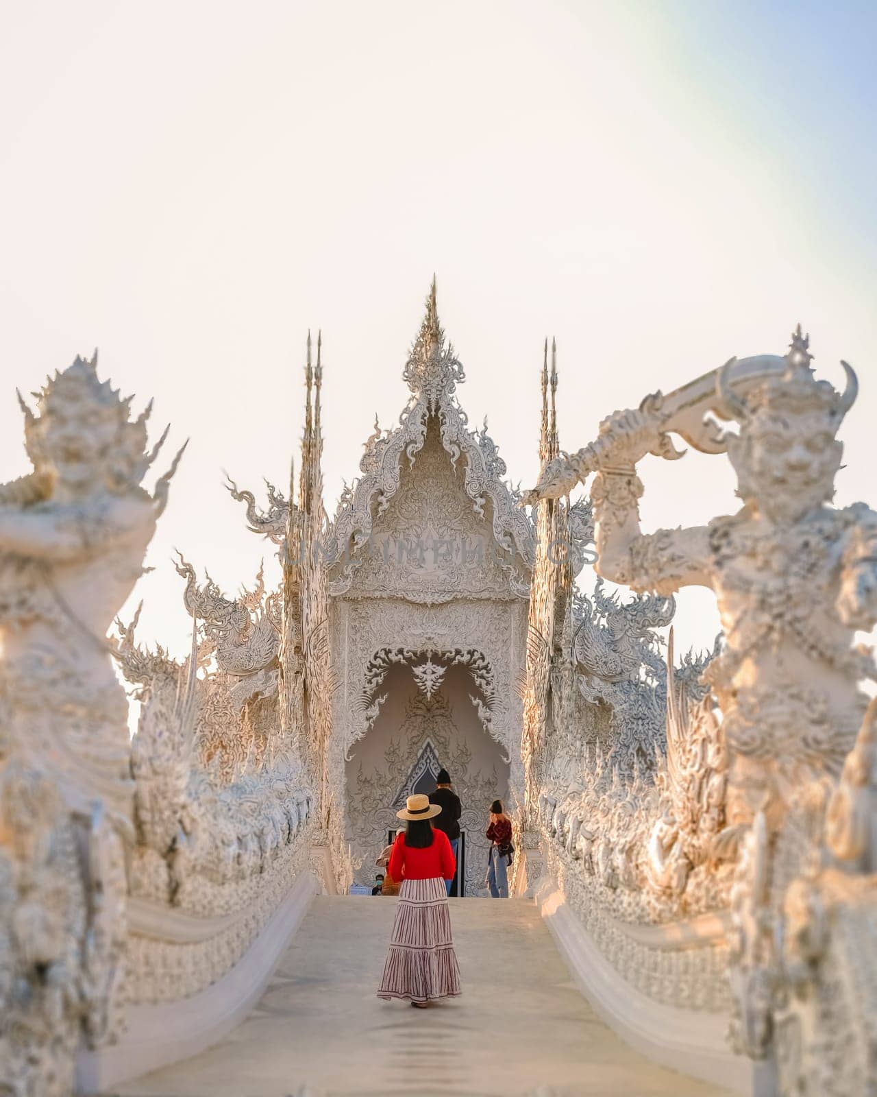 White Temple Chiang Rai Thailand, an Asian woman visits Wat Rong Khun temple, Northern Thailand.