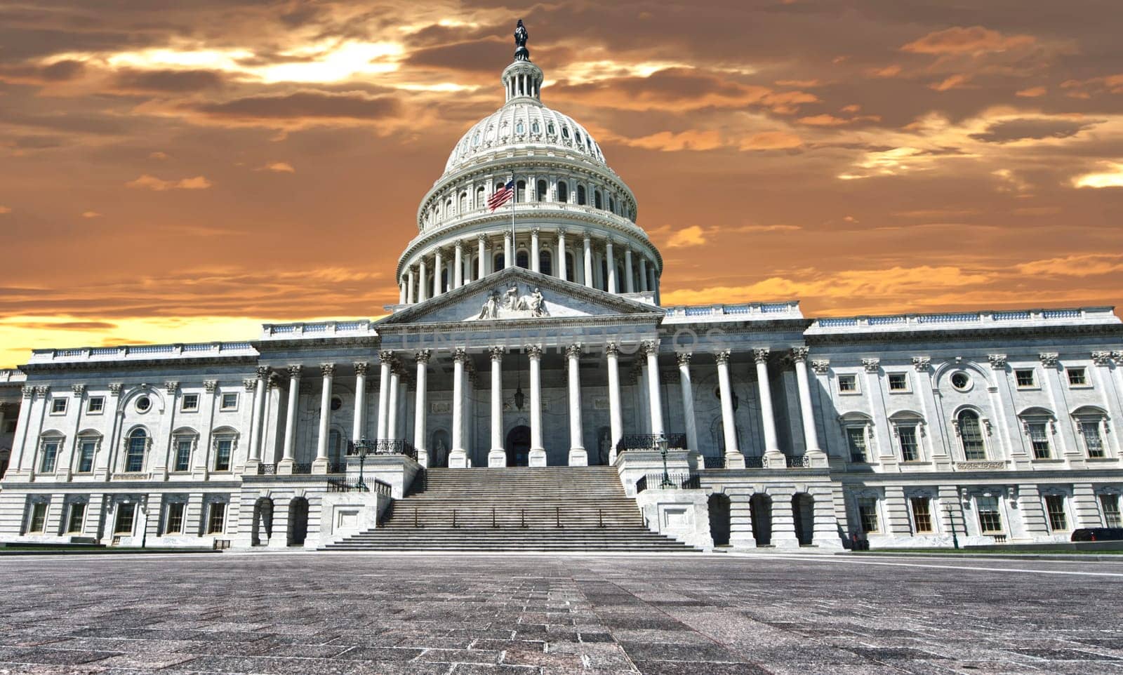 Huge view Panorama of Washington US Capitol on dramatic sunset gold sun sky background