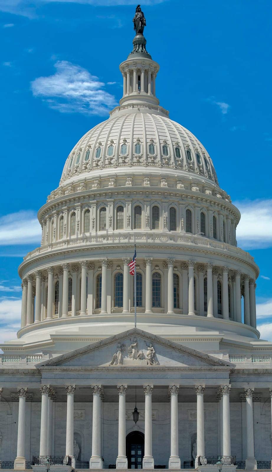 Washington DC Capitol detail with waving american flag