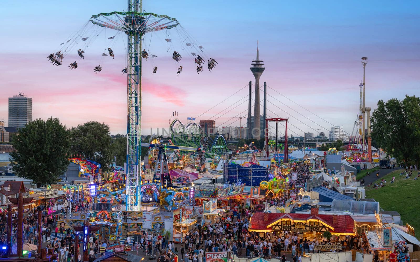 DUSSELDORF, GERMANY - JULY 18, 2023: Panoramic image of Rhine funfair of Dusseldorf on July 18, 2023 in Germany, Europe