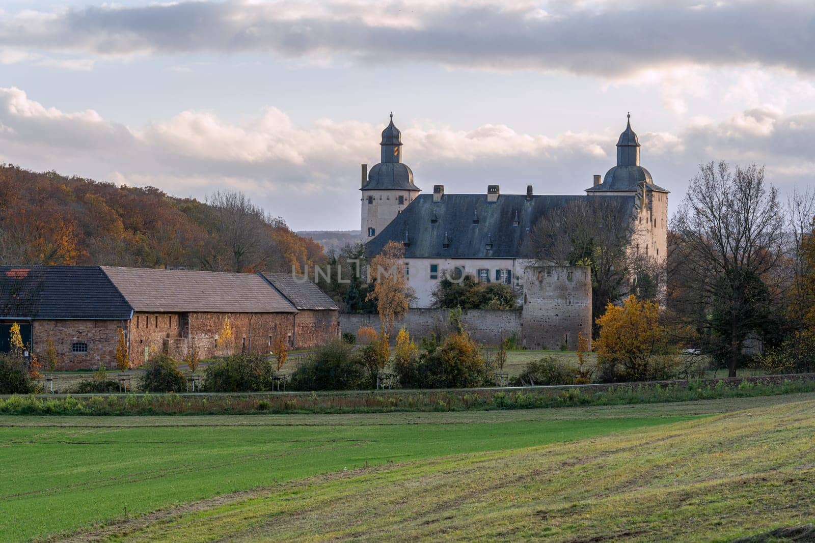 MECHERNICH, GERMANY - NOVEMBER 19, 2023: Panoramic image of old Veynau castle during evening on November 19, 2023 in Eifel, North Rhine Westphalia, Germany