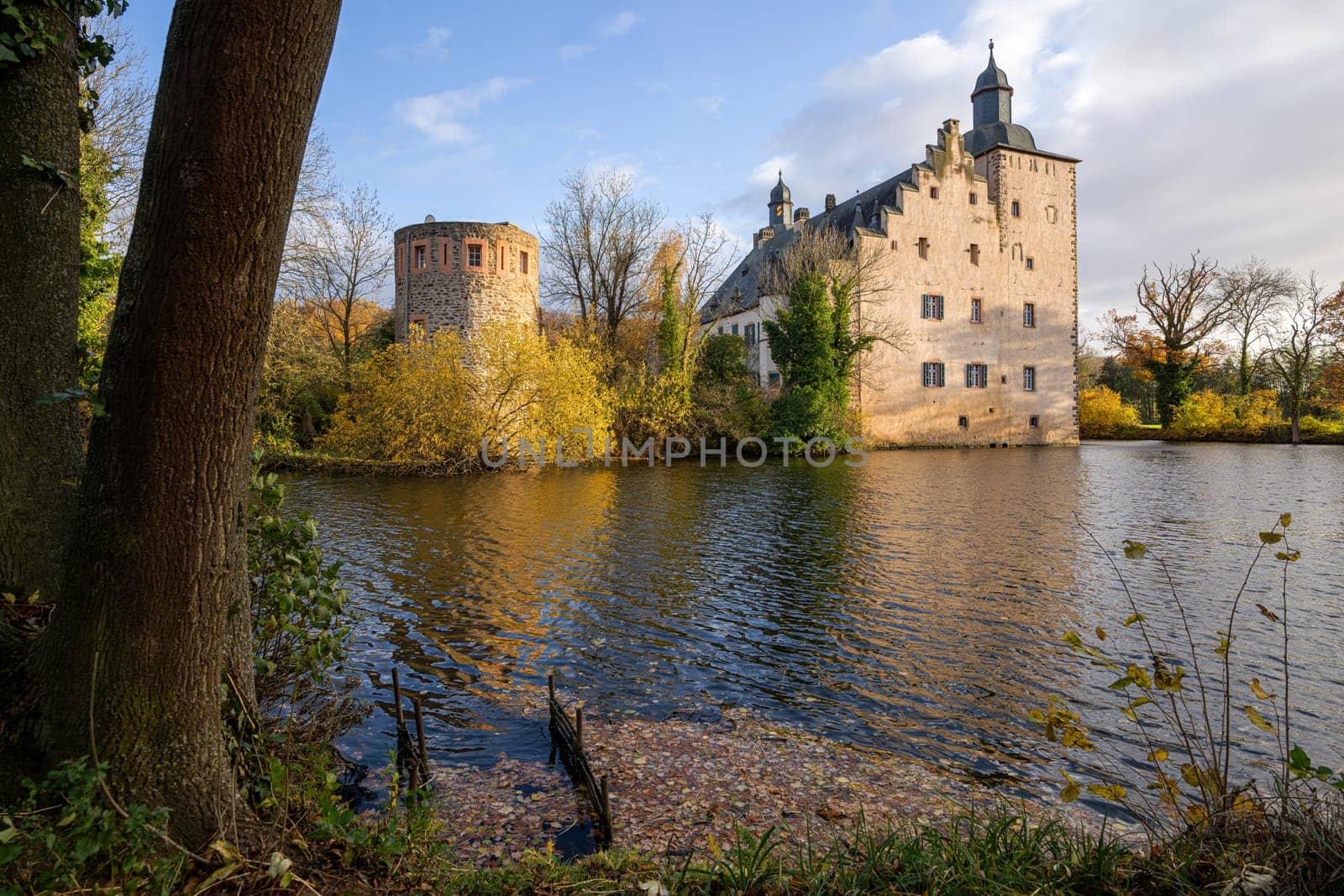 MECHERNICH, GERMANY - NOVEMBER 19, 2023: Panoramic image of old Veynau castle during evening on November 19, 2023 in Eifel, North Rhine Westphalia, Germany