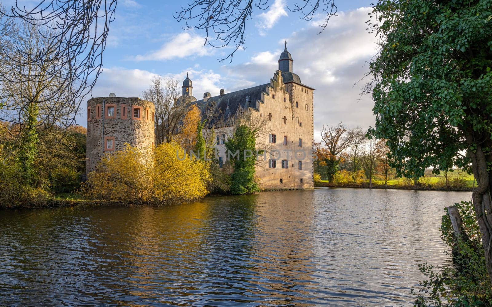 MECHERNICH, GERMANY - NOVEMBER 19, 2023: Panoramic image of old Veynau castle during evening on November 19, 2023 in Eifel, North Rhine Westphalia, Germany