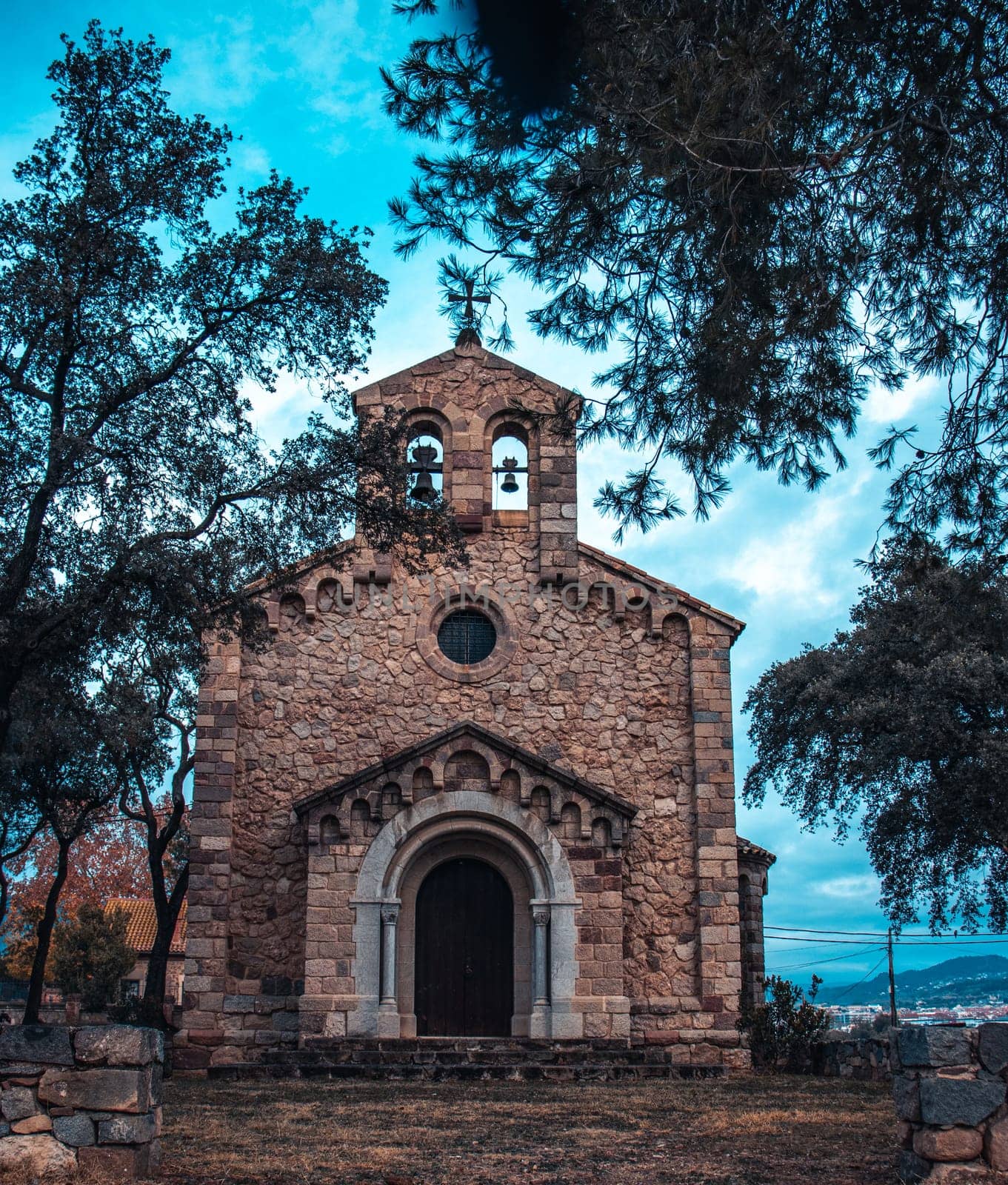 Catholic church located in Catalonia neighborhood. Red brick building surrounded by trees. by _Nataly_Nati_