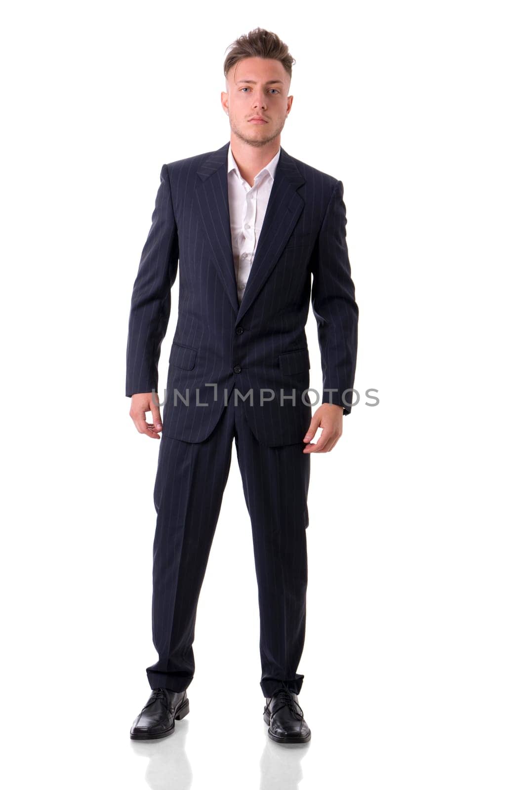 A man in a suit and tie posing for a picture, full figure shot, isolated on white in studio