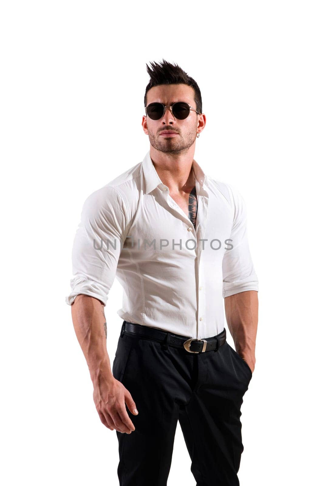 Photo of a muscular and attractive man in a white shirt and black pants by artofphoto