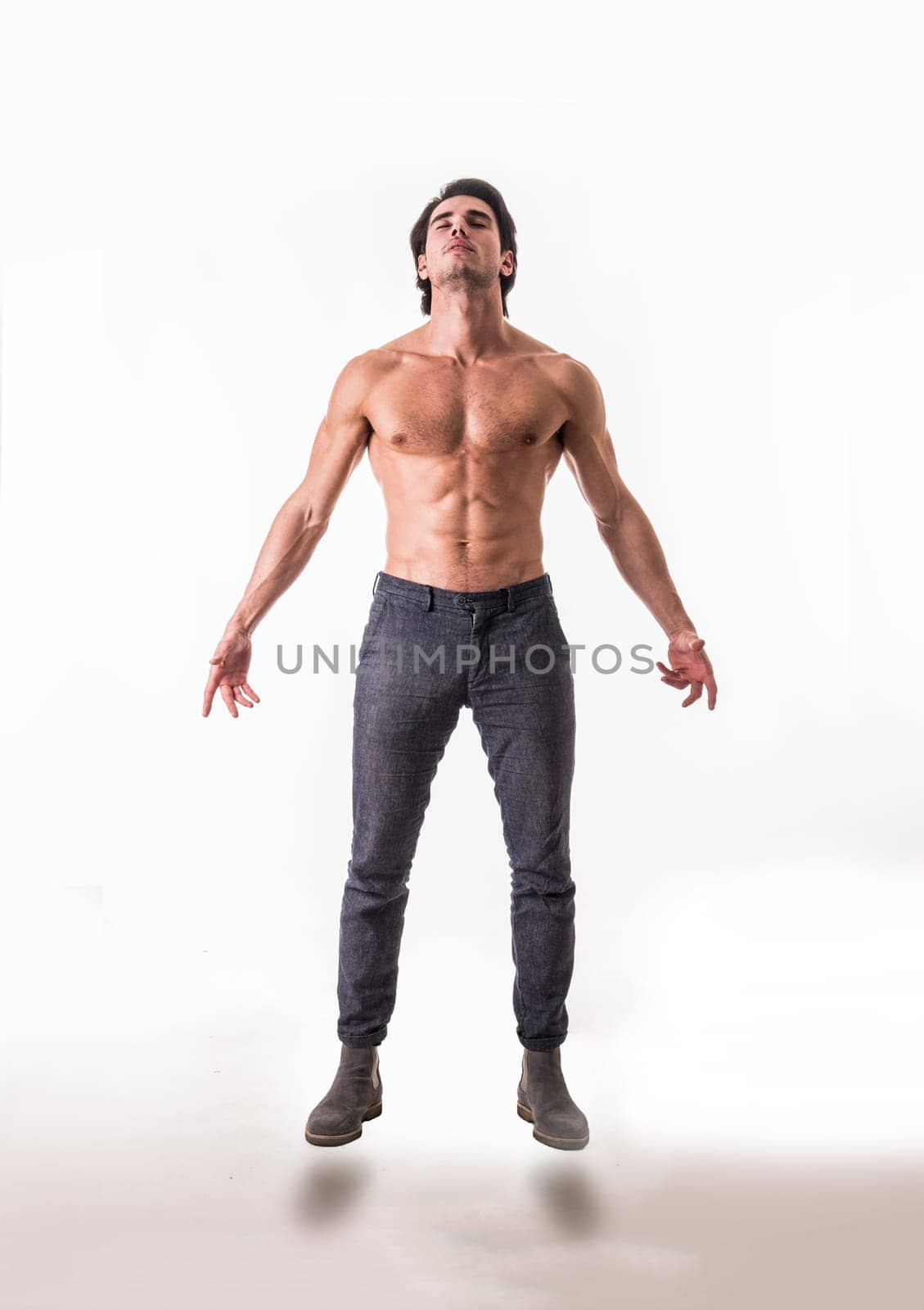 Photo of a shirtless man defying gravity in mid-air by artofphoto