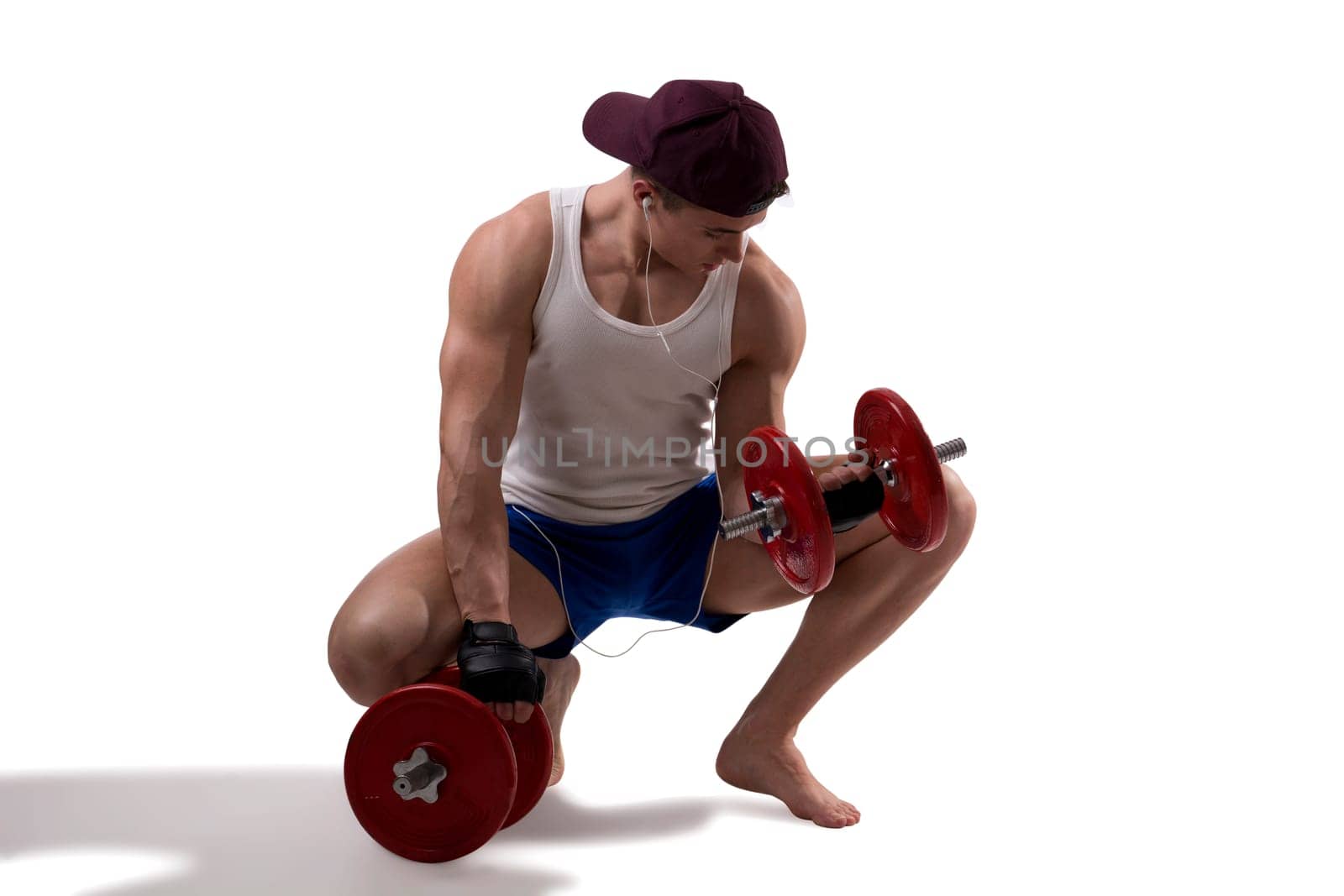 Handsome muscular young man holding dumbbells, isolated on white, full length shot, wearing tank-top
