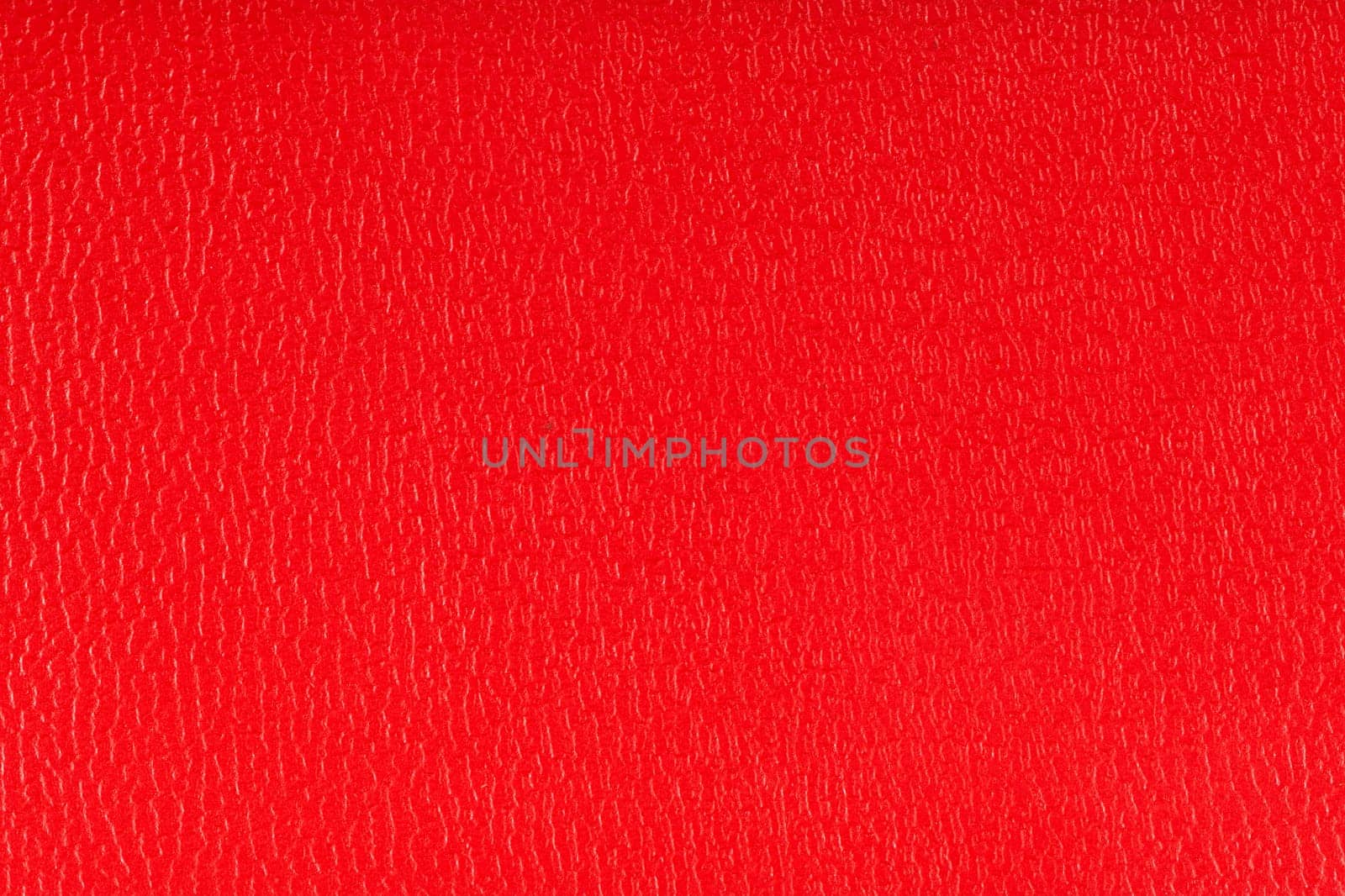 Red artificial leather texture background.