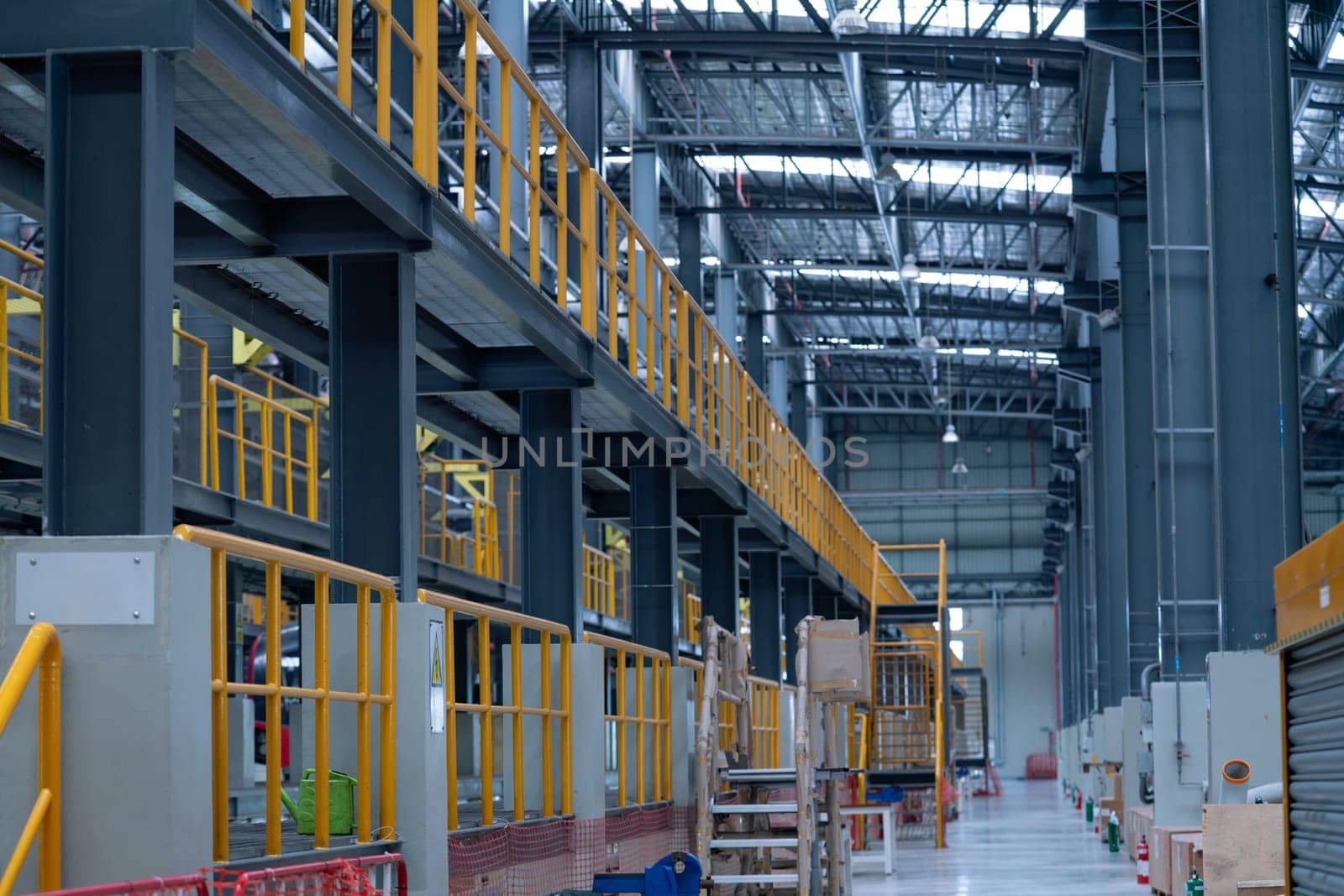 Wide shot of area of construction in electrical or metro train factory with no people and display modern and new technology for industrial work.