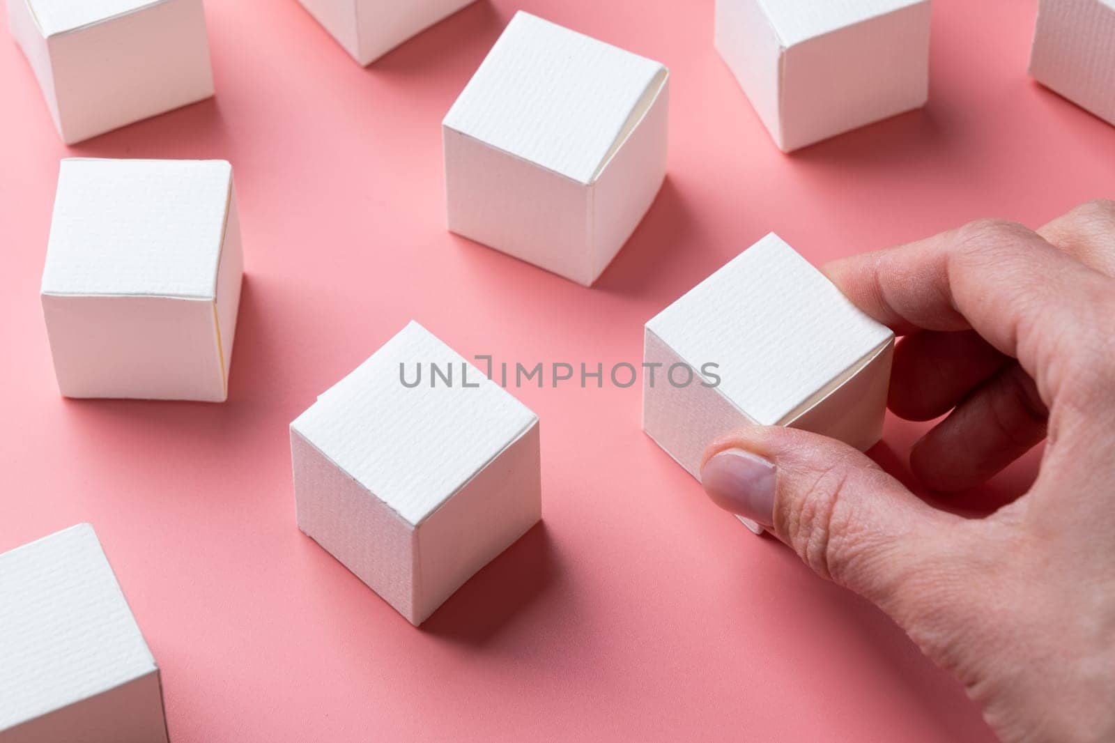 top view of colorful blank paper boxes on pink background. copy space available by Desperada
