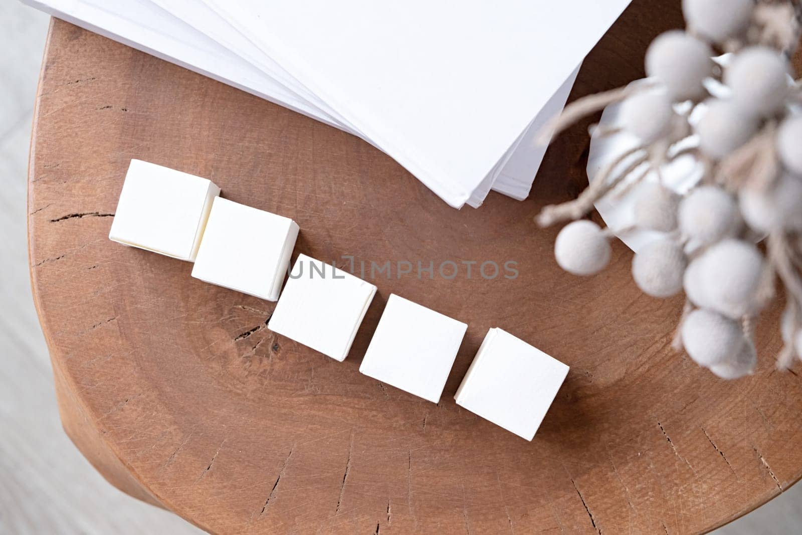 five blank white block cubes for writing a word on wooden table , Business communication concept