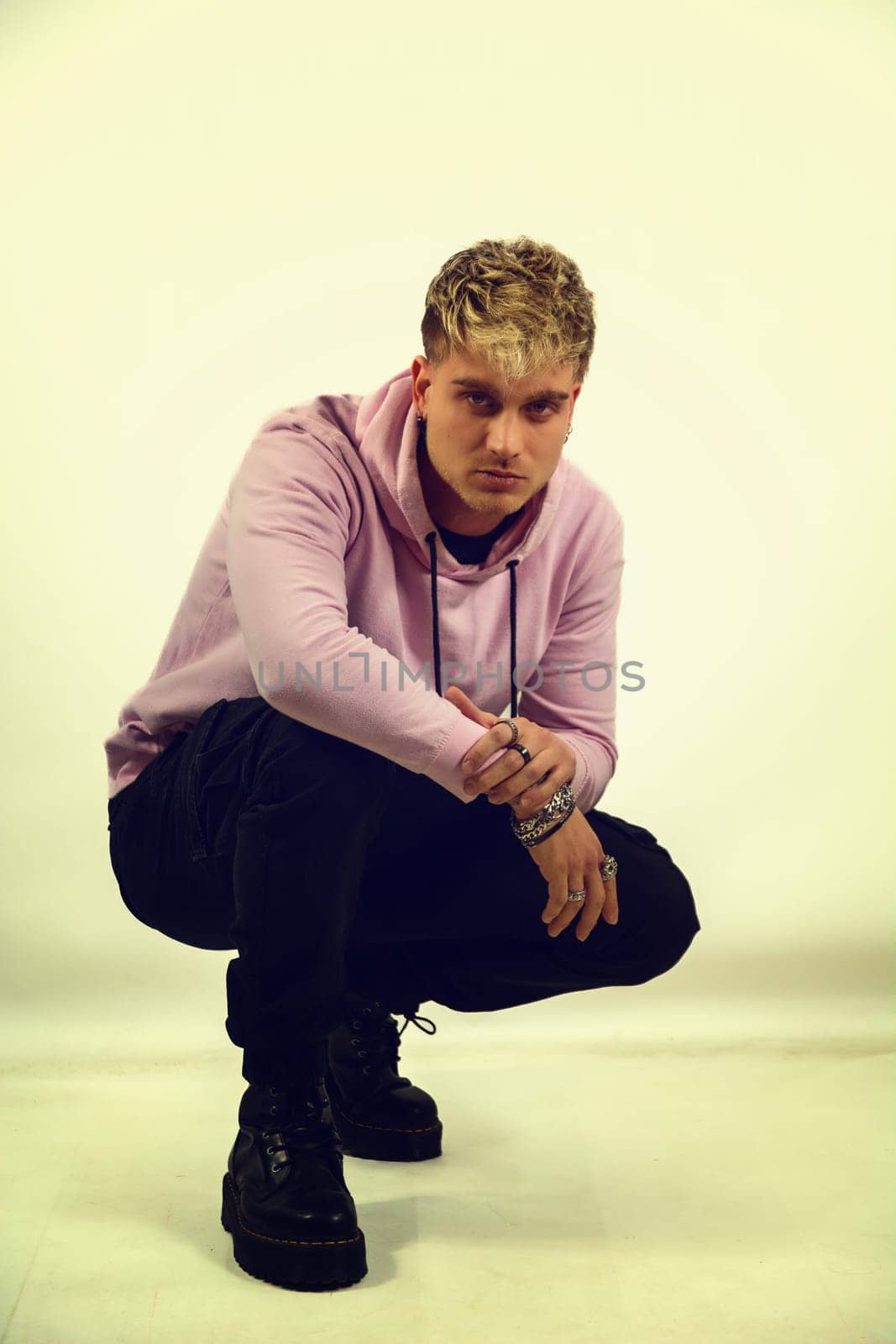 Attractive blond young man in studio shot by artofphoto