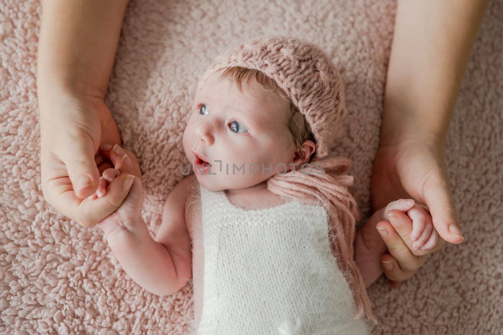 Newborn baby girl studio portrait by tan4ikk1