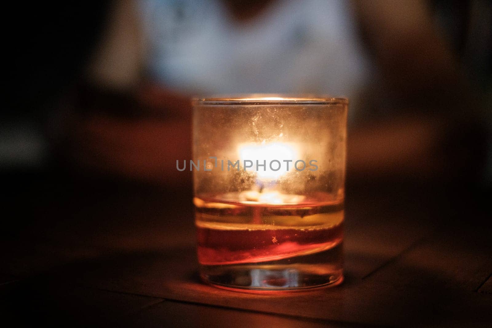 Lit Candle in Small Cup
