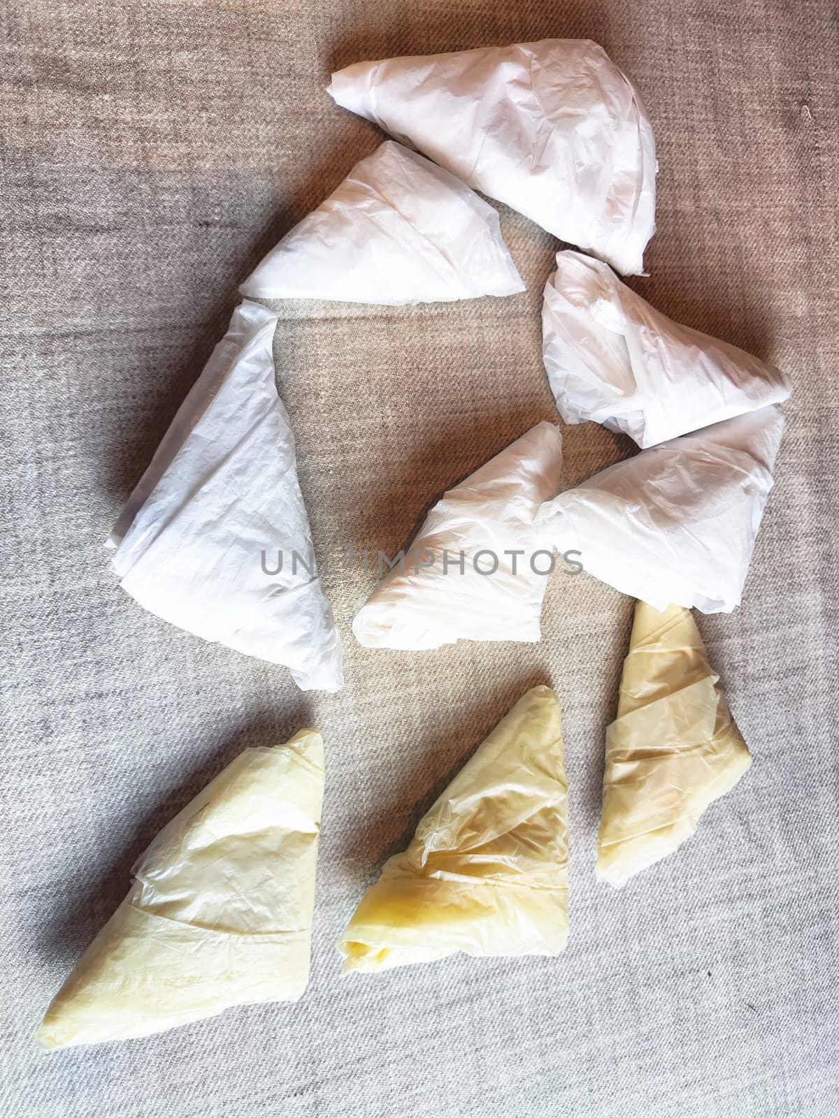 Plastic bag folded into triangle for storage. Ways of storing and laying at home