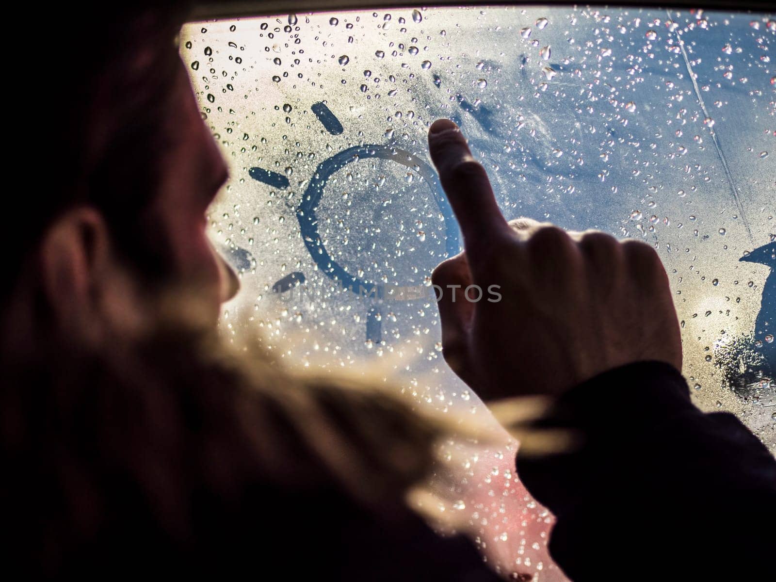 Photo of a person looking out of a car window by artofphoto