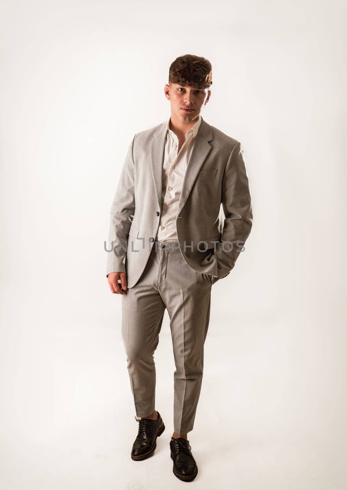 Full figure shot of handsome elegant young man with business suit, by artofphoto