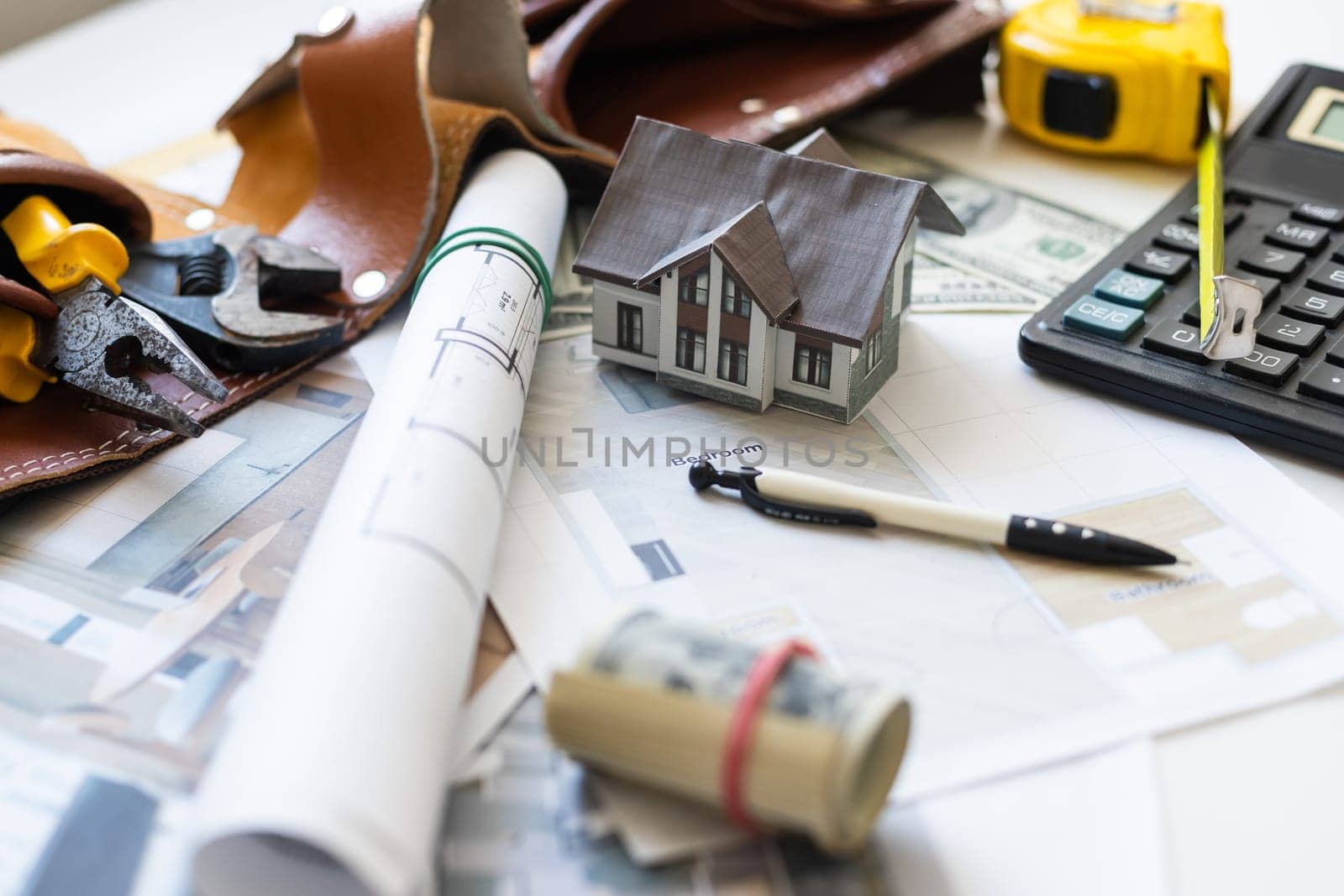 engineering tools on wooden table with drawings apartments top view. High quality photo