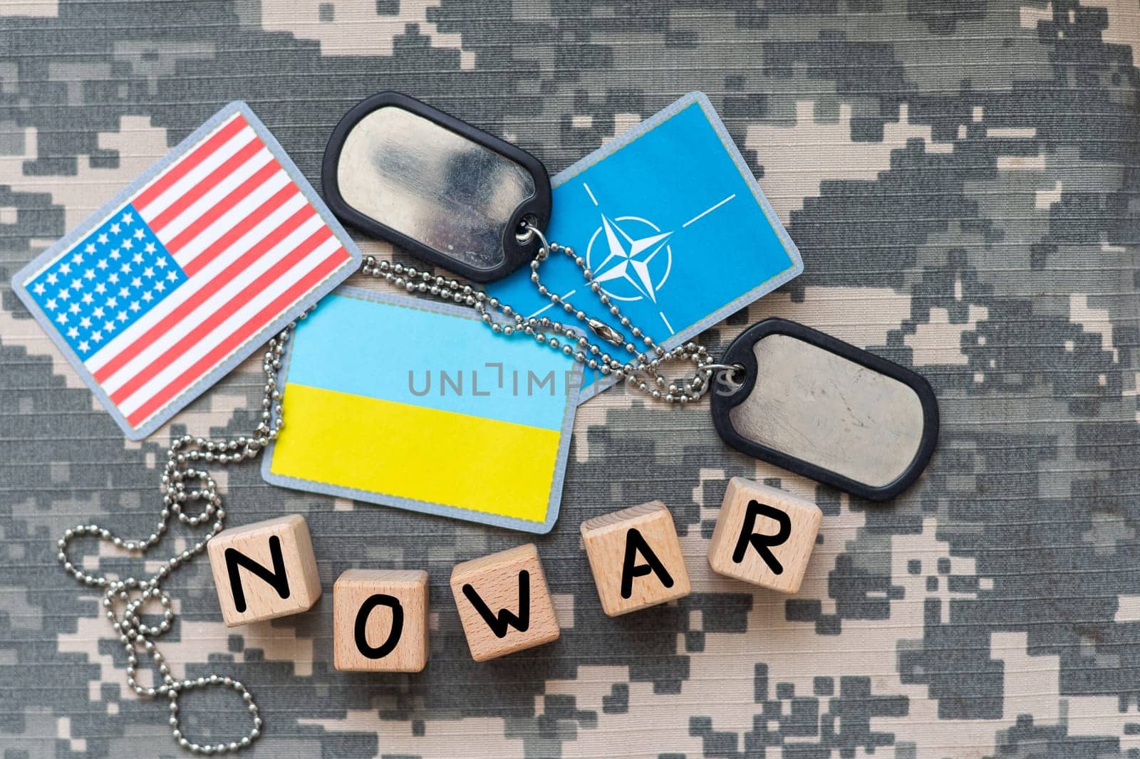 Military patch and bullets on pixel Ukrainian camouflage, closeup no war. High quality photo