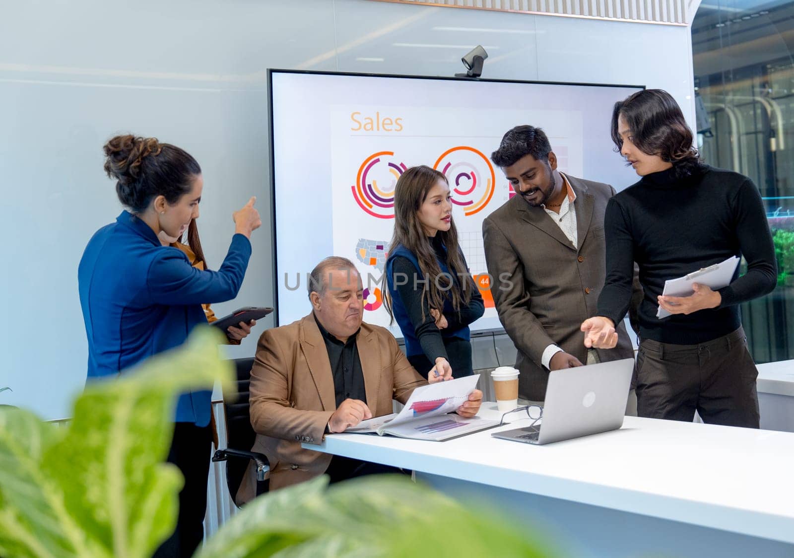 Group of business men and women with multiethnic and multigeneration discuss in the conference room to get the success of the project.